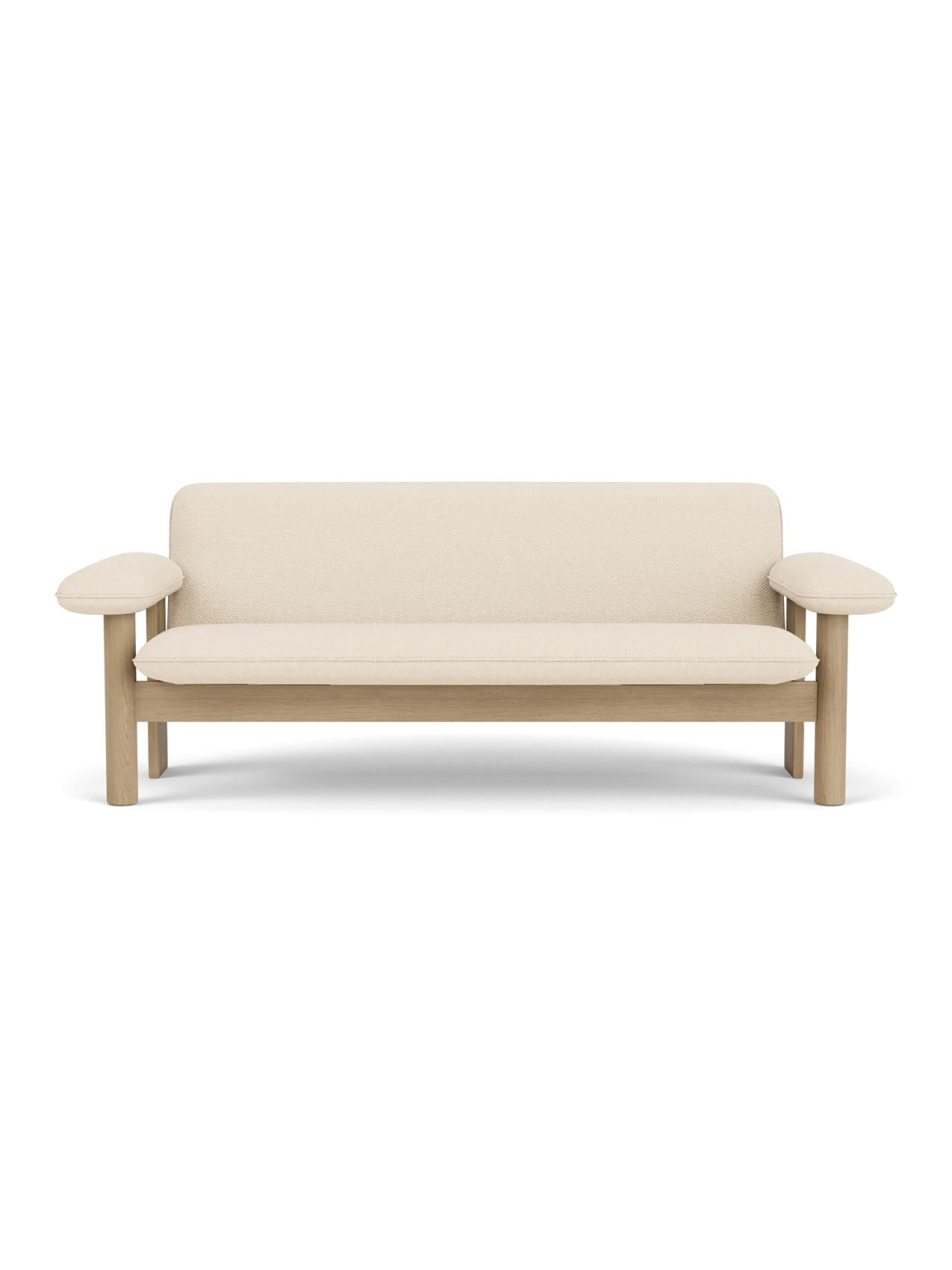 A front-on view of the Brasilia Sofa, featuring a natural oak frame with rounded armrests and plush Logan Jasmine upholstery.