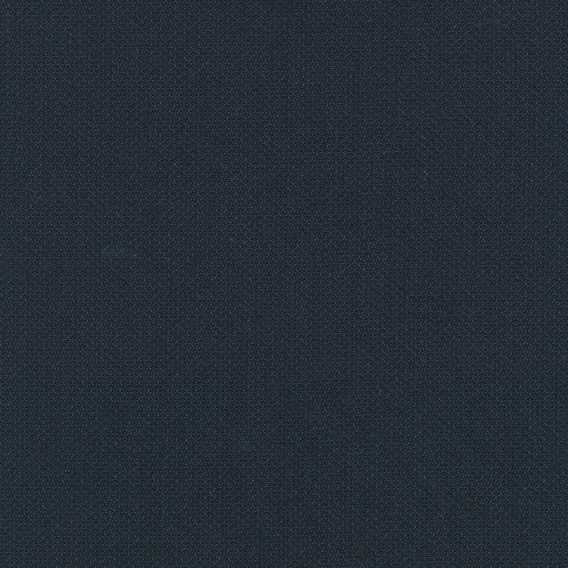 Close-up of navy blue woven textile with small pebbled texture and subtle darker fibers