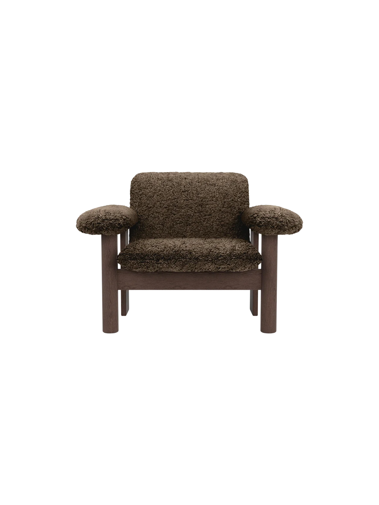 Front view of the Brasilia Lounge Chair, Low Back, in brown sheepskin with a dark stained oak frame on a black background.