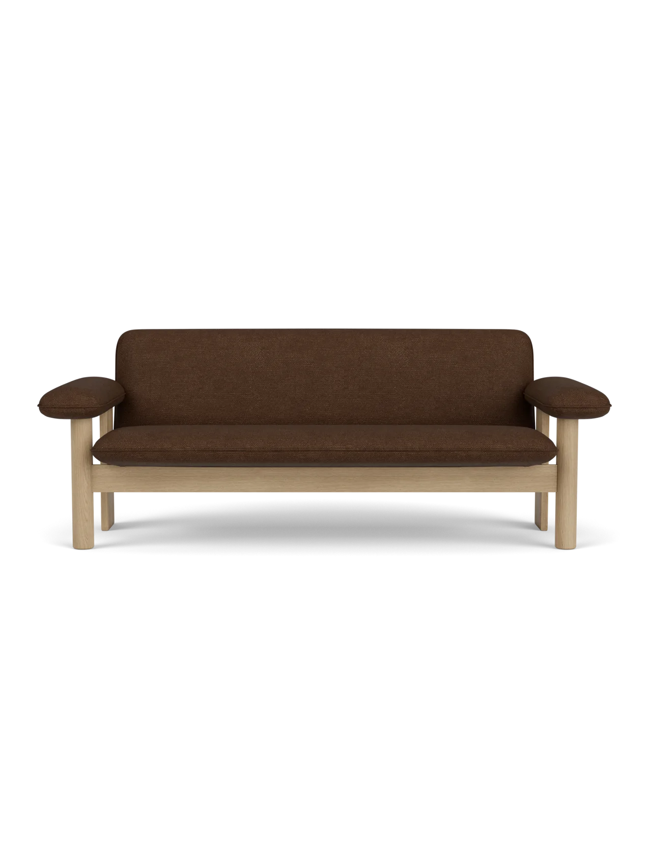 A front-on view of the Brasilia Sofa with a natural oak frame, exaggerated armrests and brown Audo Bouclé 07 upholstery.