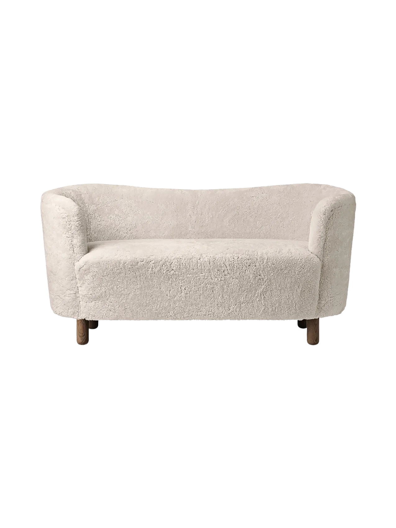 Front view of the Mingle Sofa in Moonlight sheepskin, with a curved back and dark stained oak legs on a black background.