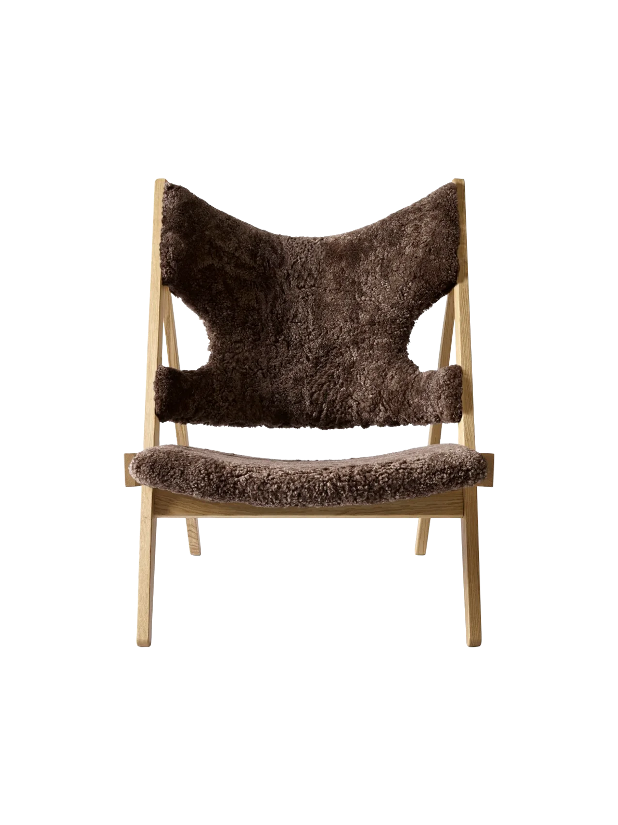 A front photo of the Knitting Lounge Chair. It features a Natural Oak frame and plush, dark brown Root Sheepskin upholstery.
