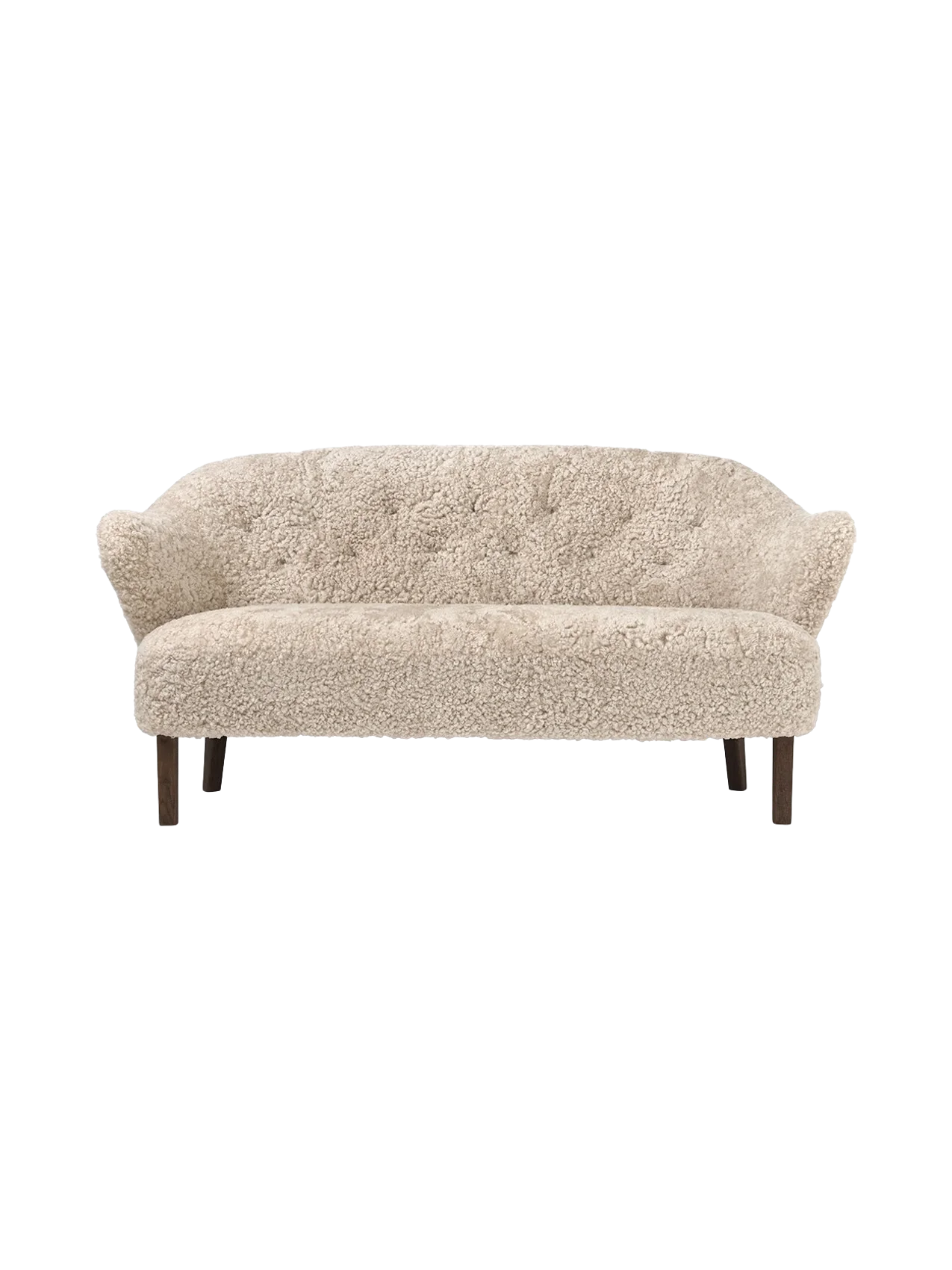 Front view of the Ingeborg Sofa in Moonlight sheepskin upholstery. The elegant sofa has a buttoned back and dark wood legs.