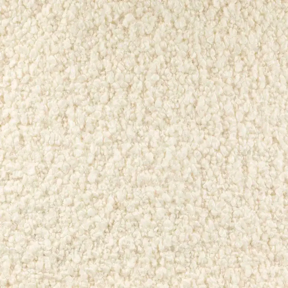 Close-up of off-white bouclé fabric with dense, looped woolly texture and soft, nubby surface