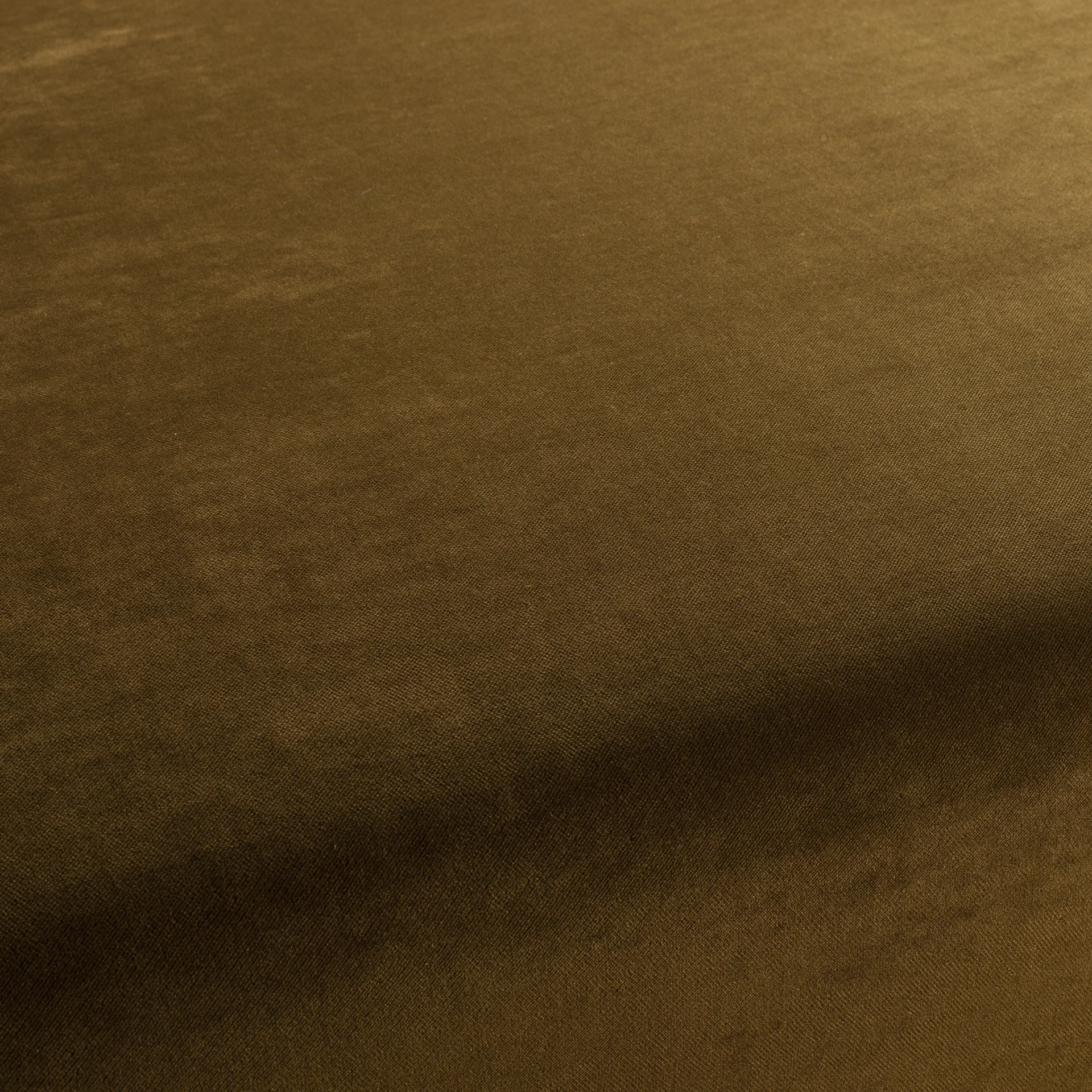 Brown velvet upholstery fabric with soft nap and subtle woven texture, close-up.