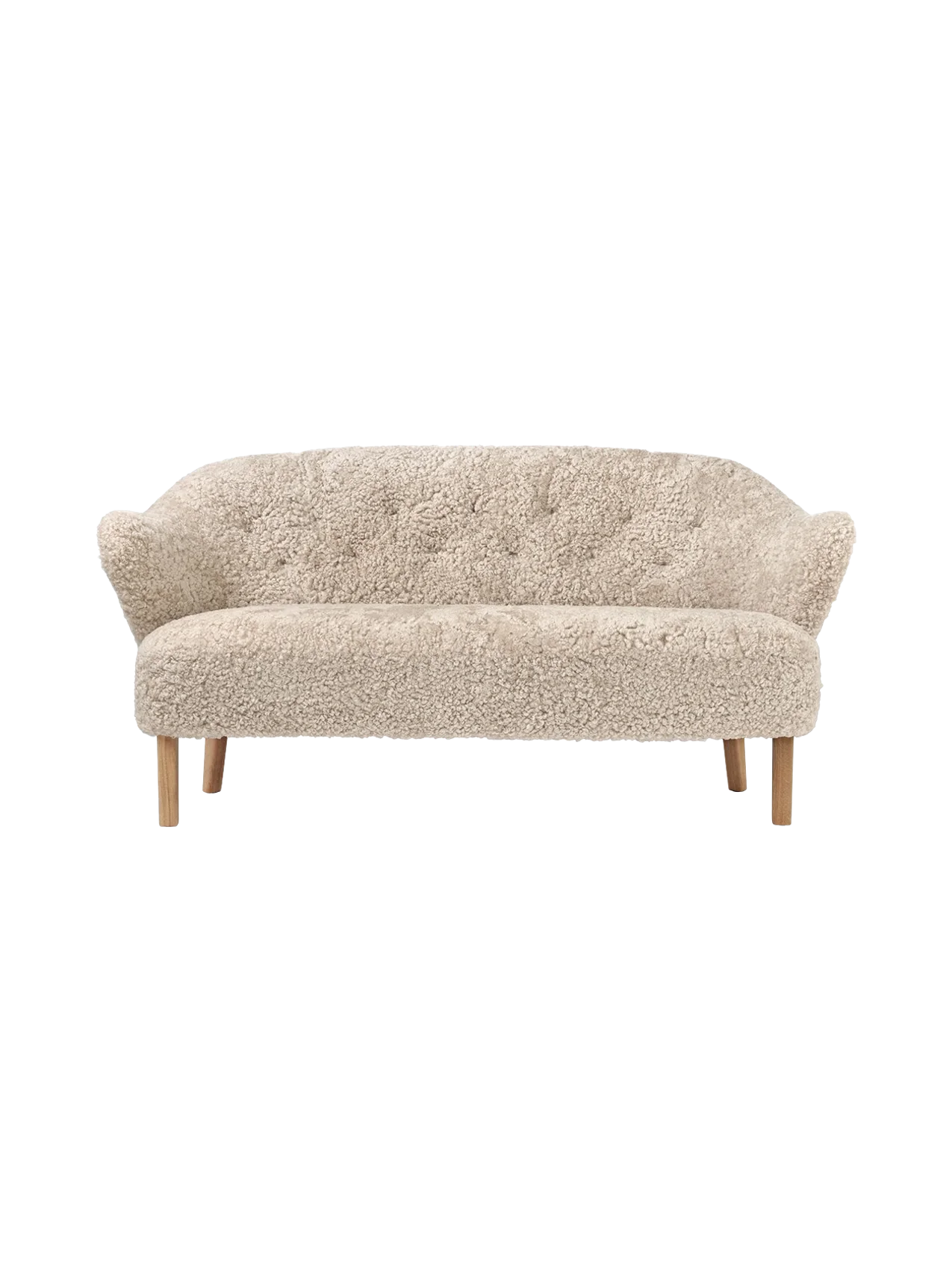 Front view of the Ingeborg Sofa in off-white Moonlight sheepskin, featuring a button-tufted back, flared arms, and oak legs.
