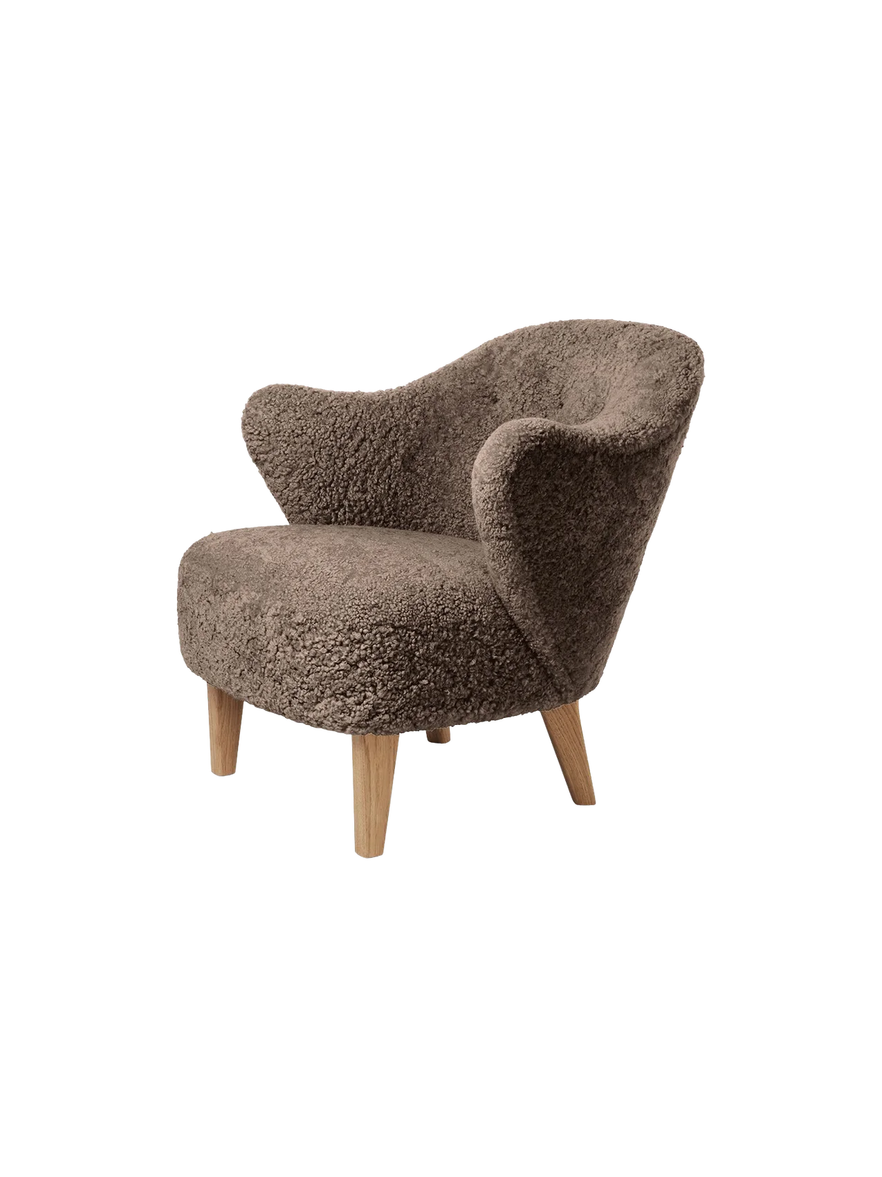 Angled view of the Ingeborg Lounge Chair in textured, brown Sahara sheepskin with light oak legs on a black background.