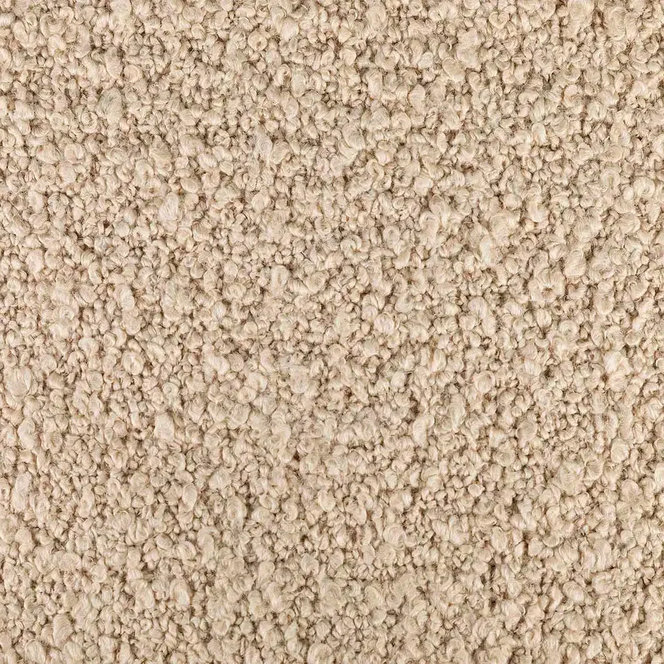 A close-up, detailed image of a cream-coloured bouclé fabric, showcasing its distinctive looped and nubby texture.
