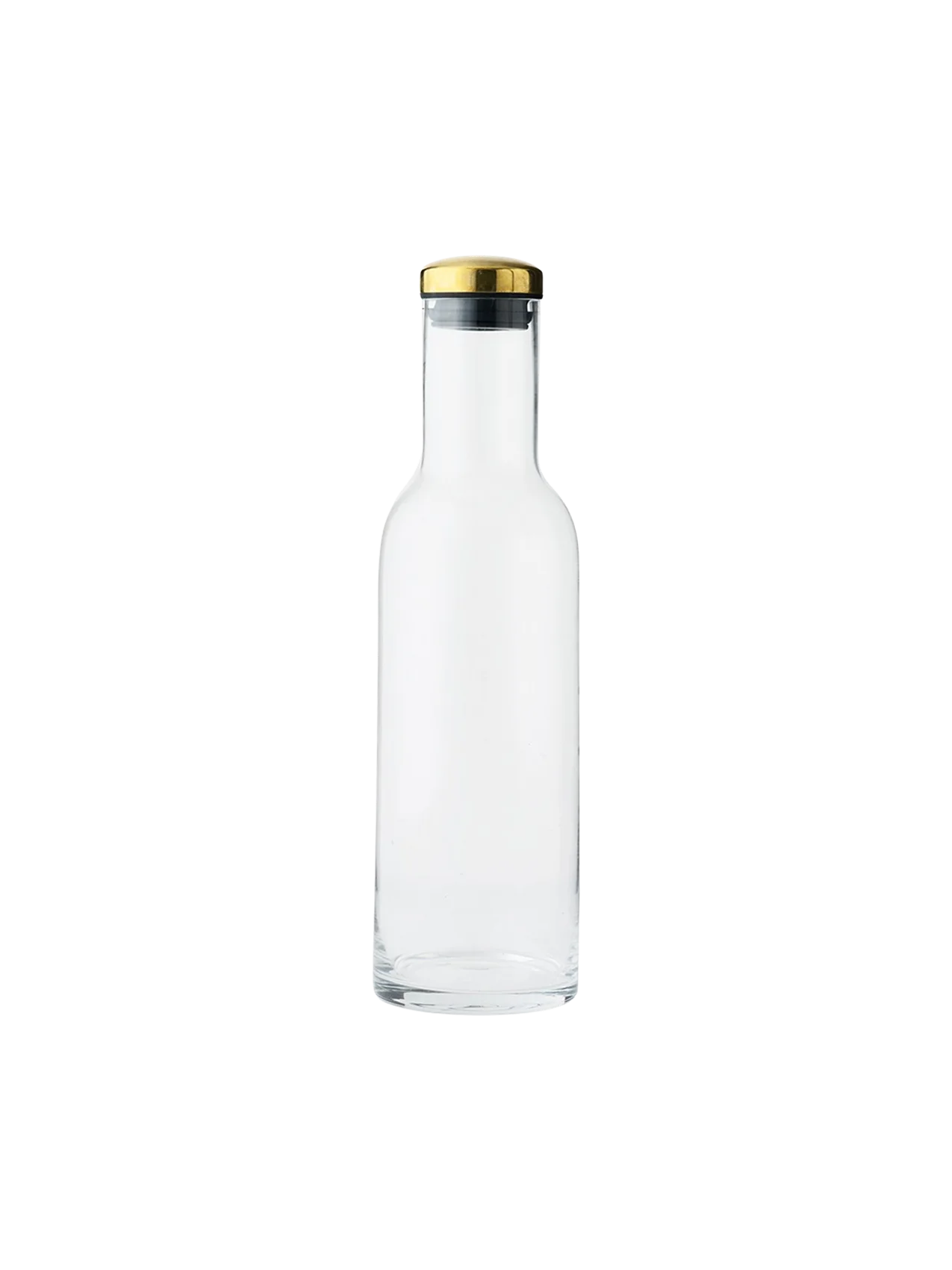 A minimalist clear glass Bottle Carafe with a straight body and sloped shoulders, sealed with a polished brass and black lid.