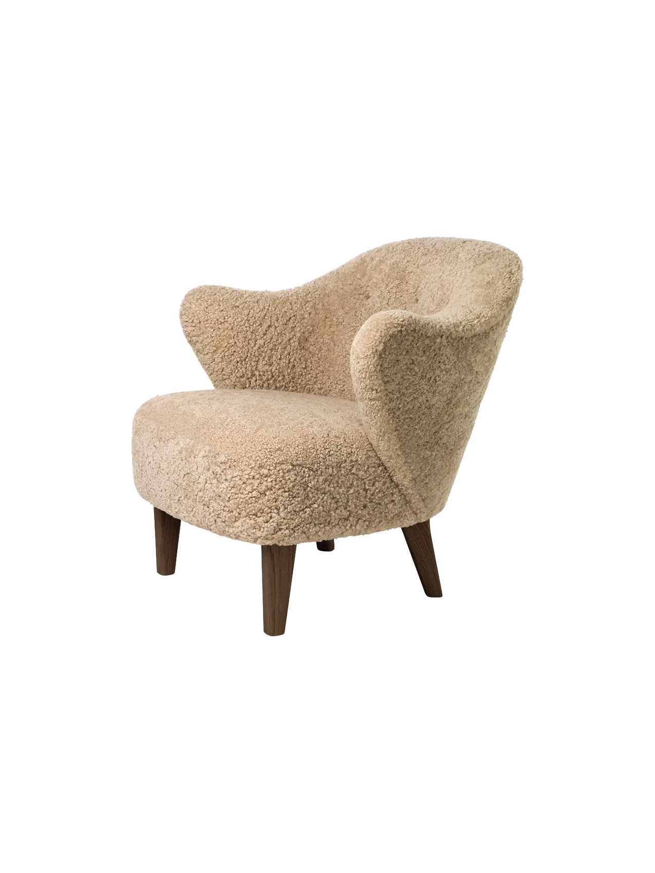 A three-quarter view of the Ingeborg Lounge Chair in textured honey sheepskin with sculptural arms and dark oak legs.