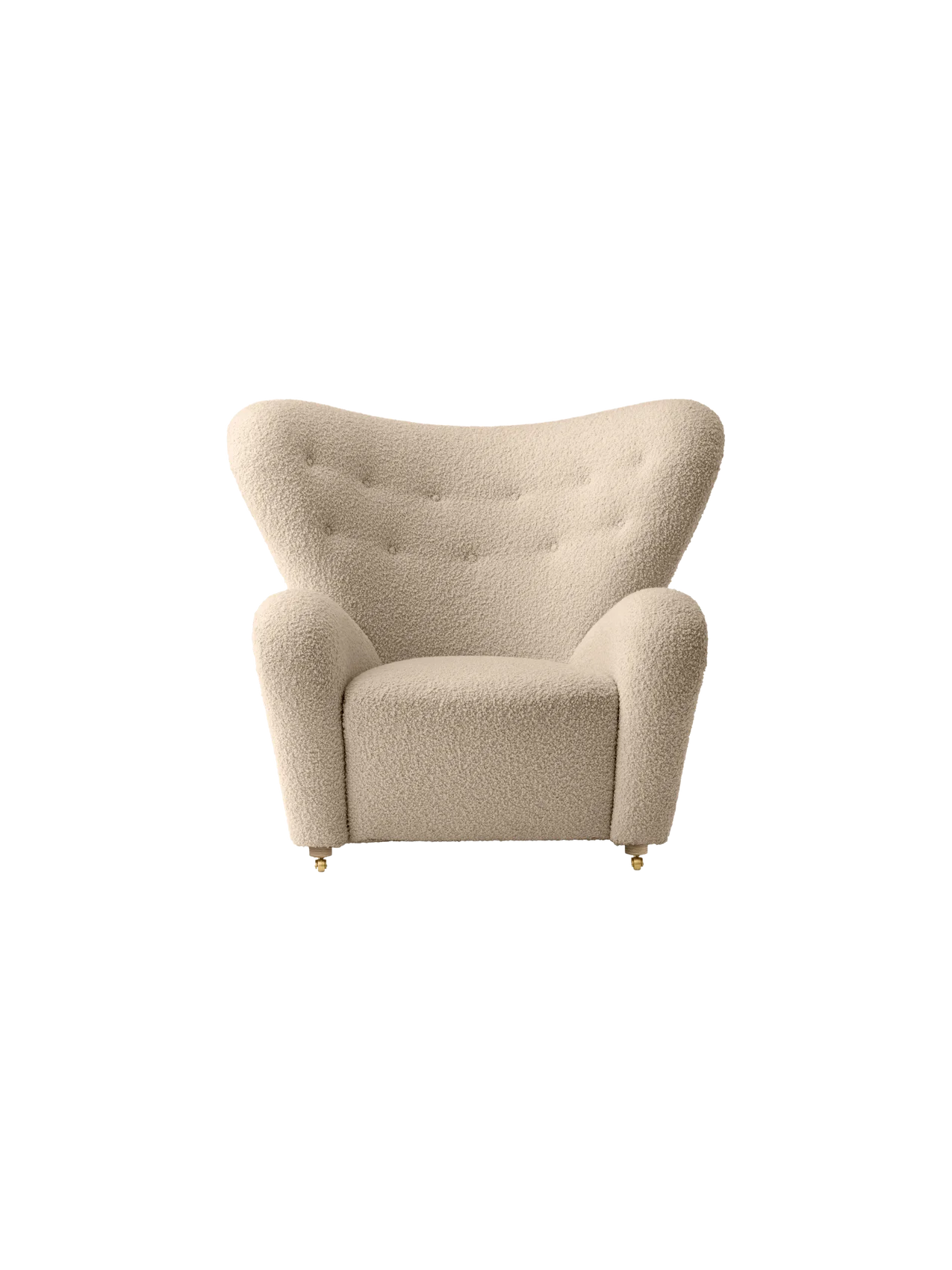 The Tired Man Lounge Chair, upholstered in a light, textured fabric with a tufted winged back and brass castors.