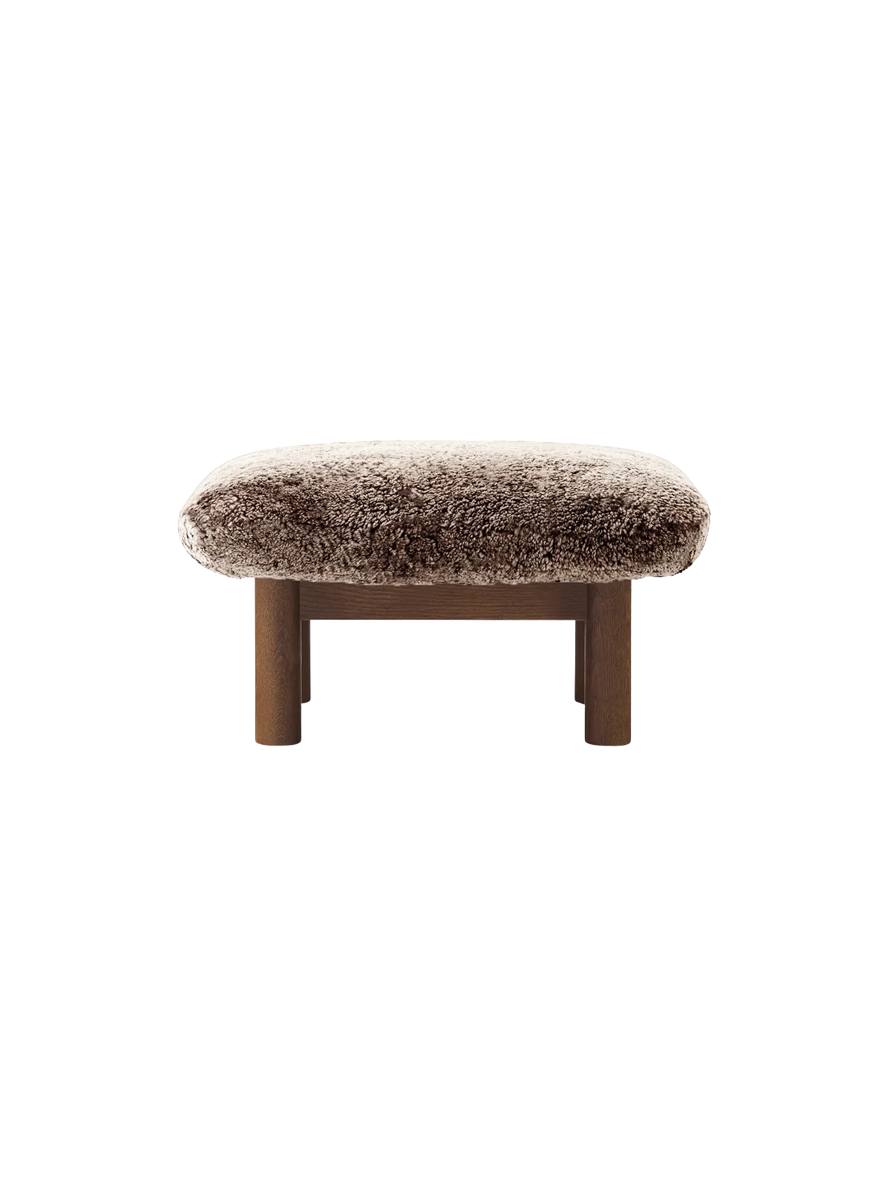 Front view of the Brasilia Ottoman with a dark stained oak frame, cylindrical legs and a fluffy Root sheepskin cushion.