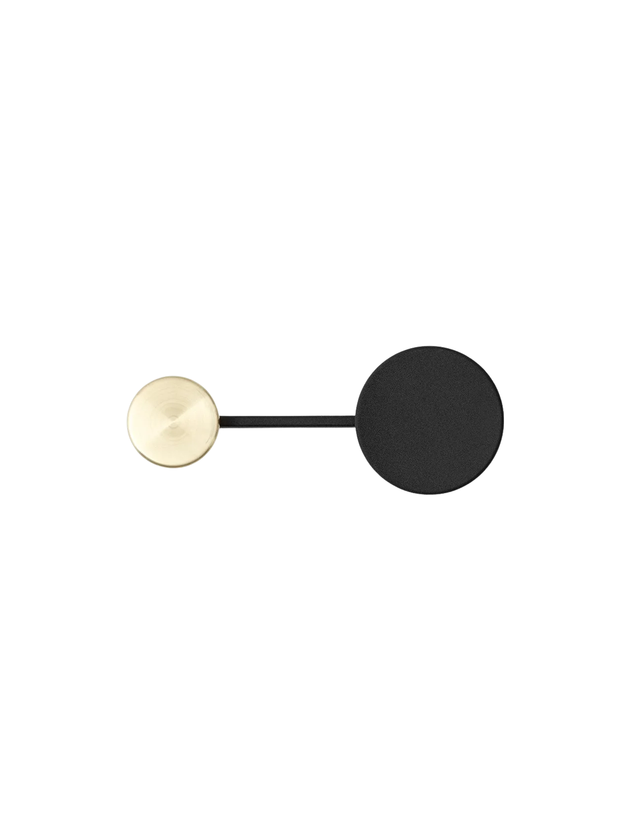 Top-down view of the small Afteroom Coat Hanger in black, with its large matte black disc and smaller brushed brass hook.