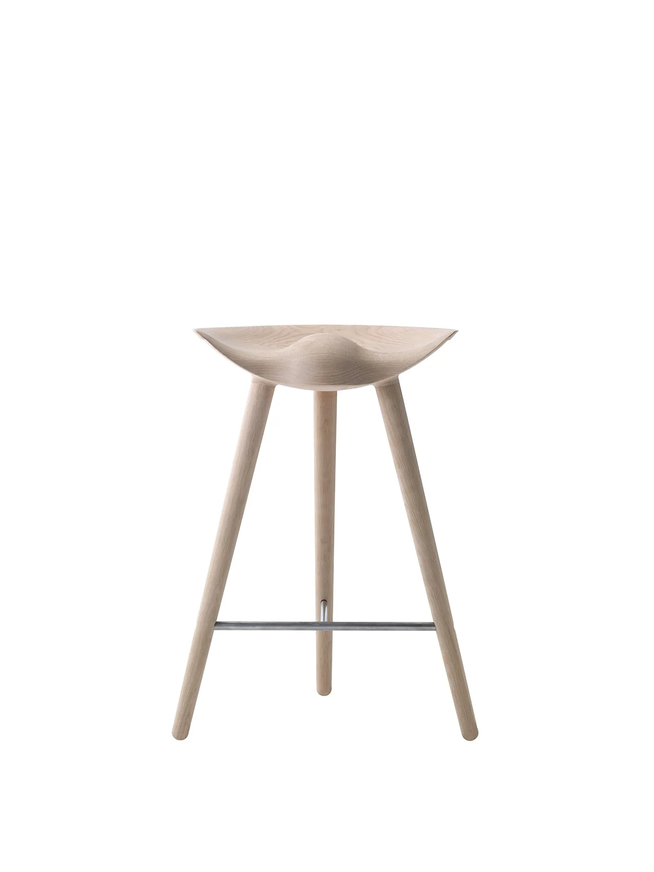 A front-on shot of the ML 42 Counter Stool in light oak, with a sculpted seat, three legs, and a steel footrest.