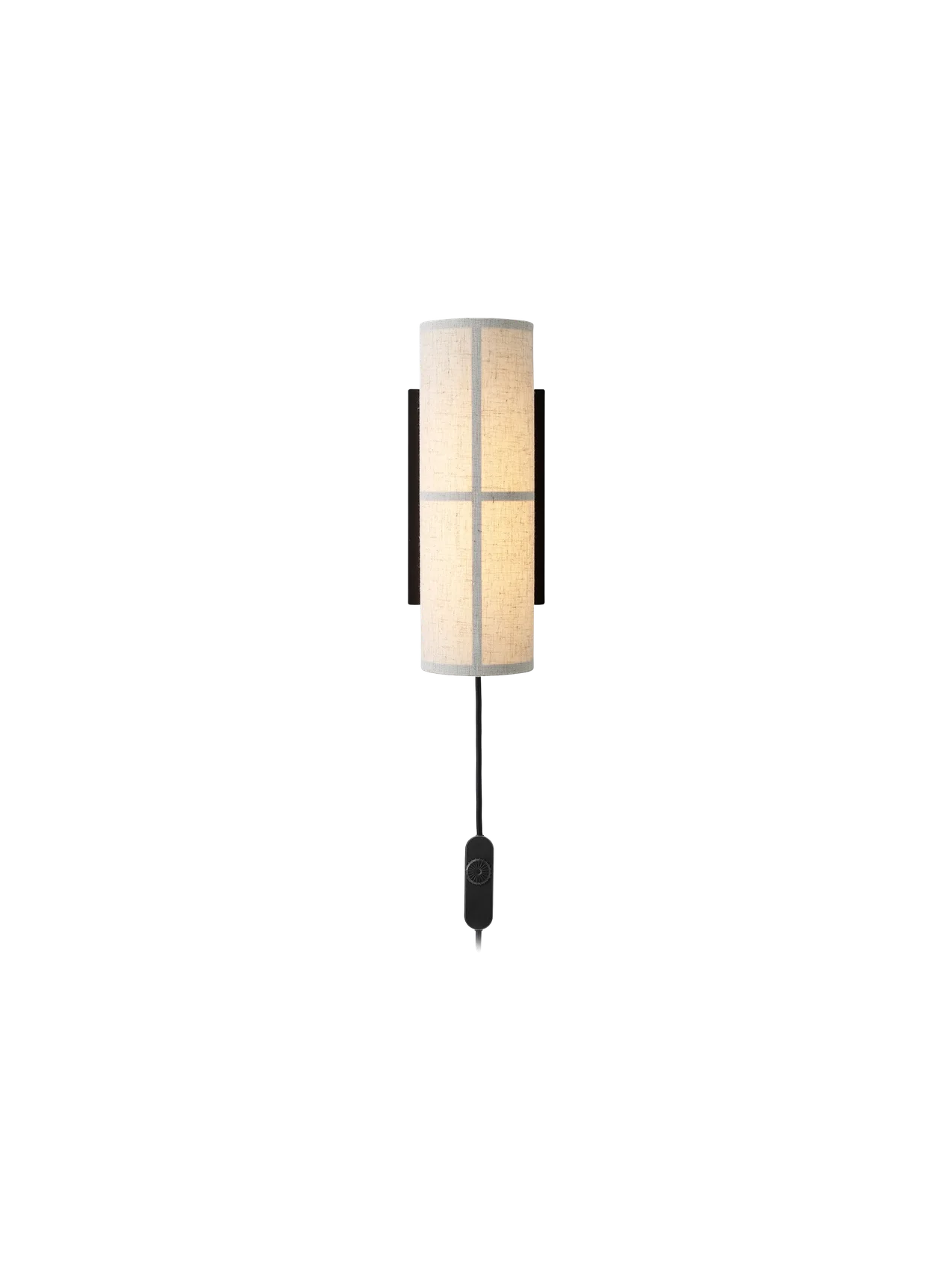 A front-on view of the Hashira Wall Lamp in a raw linen finish, illuminated against a plain black background.