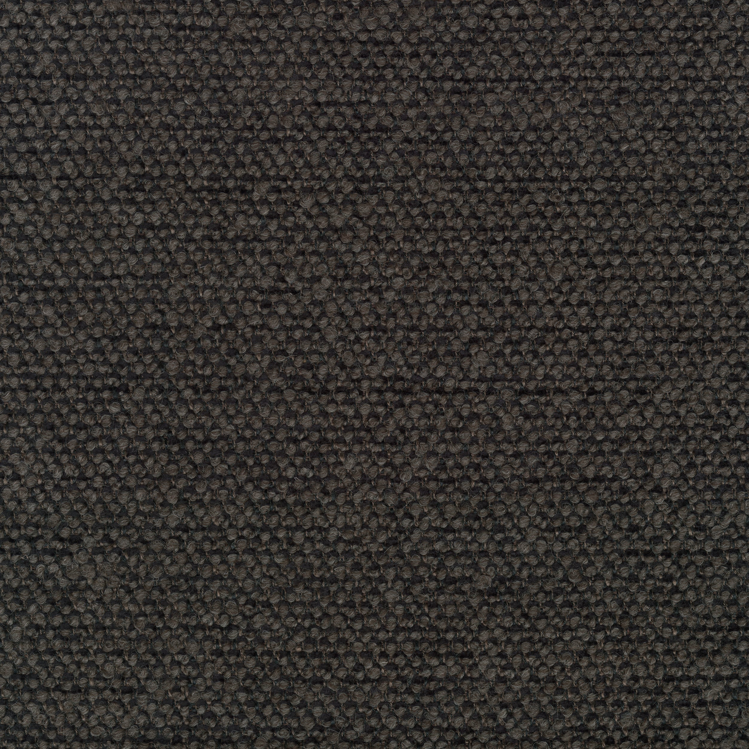 Close-up of dark charcoal wool boucle fabric with dense looped texture and subtle brown-gray tones.