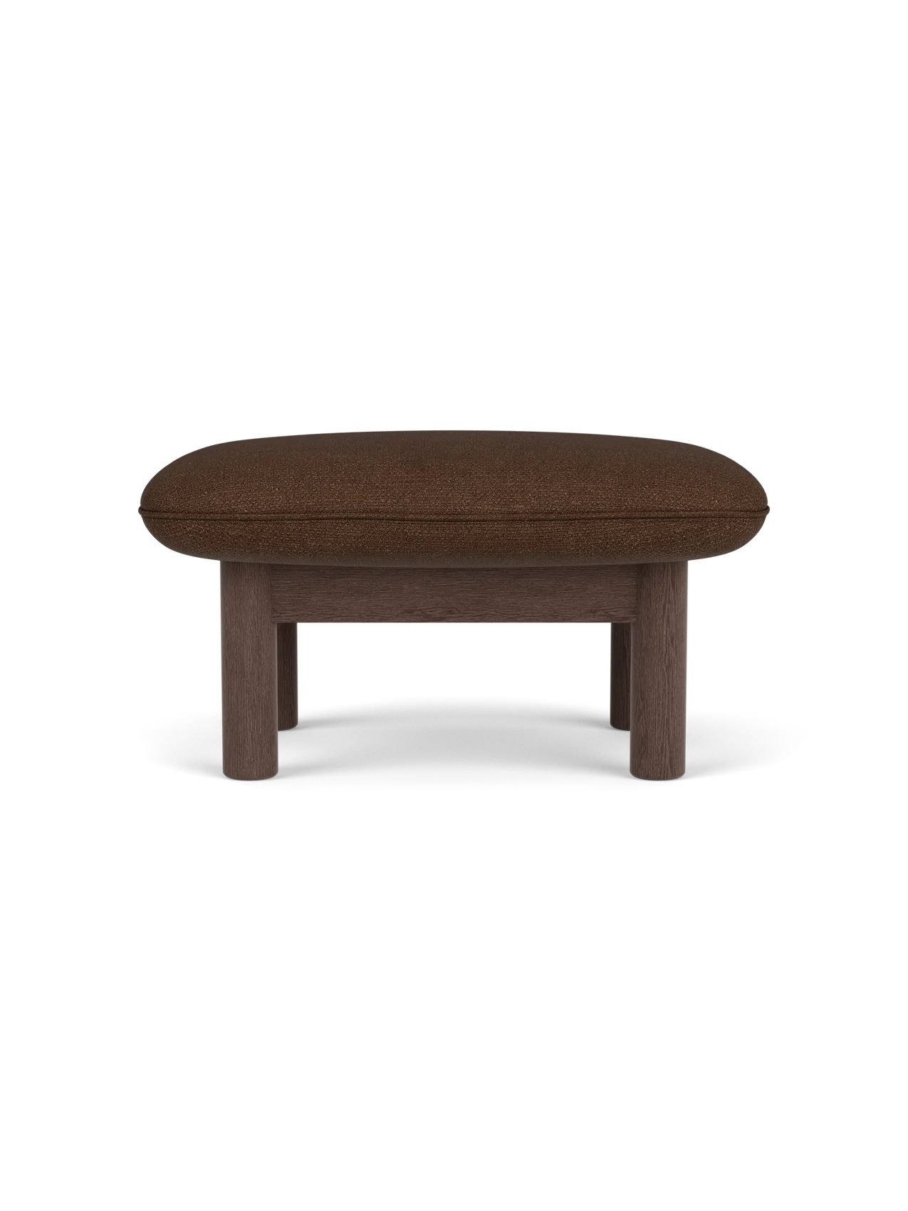 Side view of the Brasilia Ottoman, upholstered in brown Audo Bouclé 07 fabric, with four sturdy dark stained oak legs.