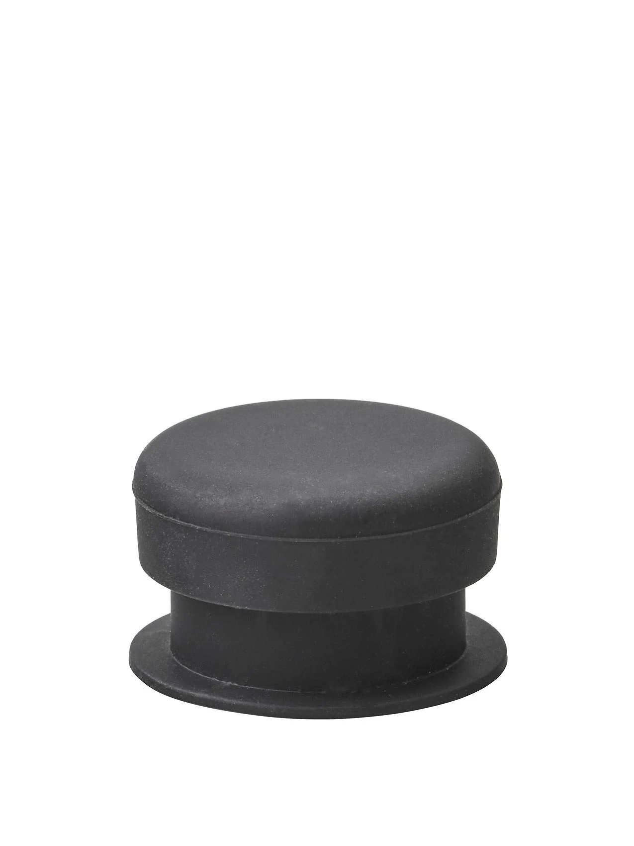 A close-up photograph of a small, cylindrical black component, likely a rubber stopper or foot, against a white background.