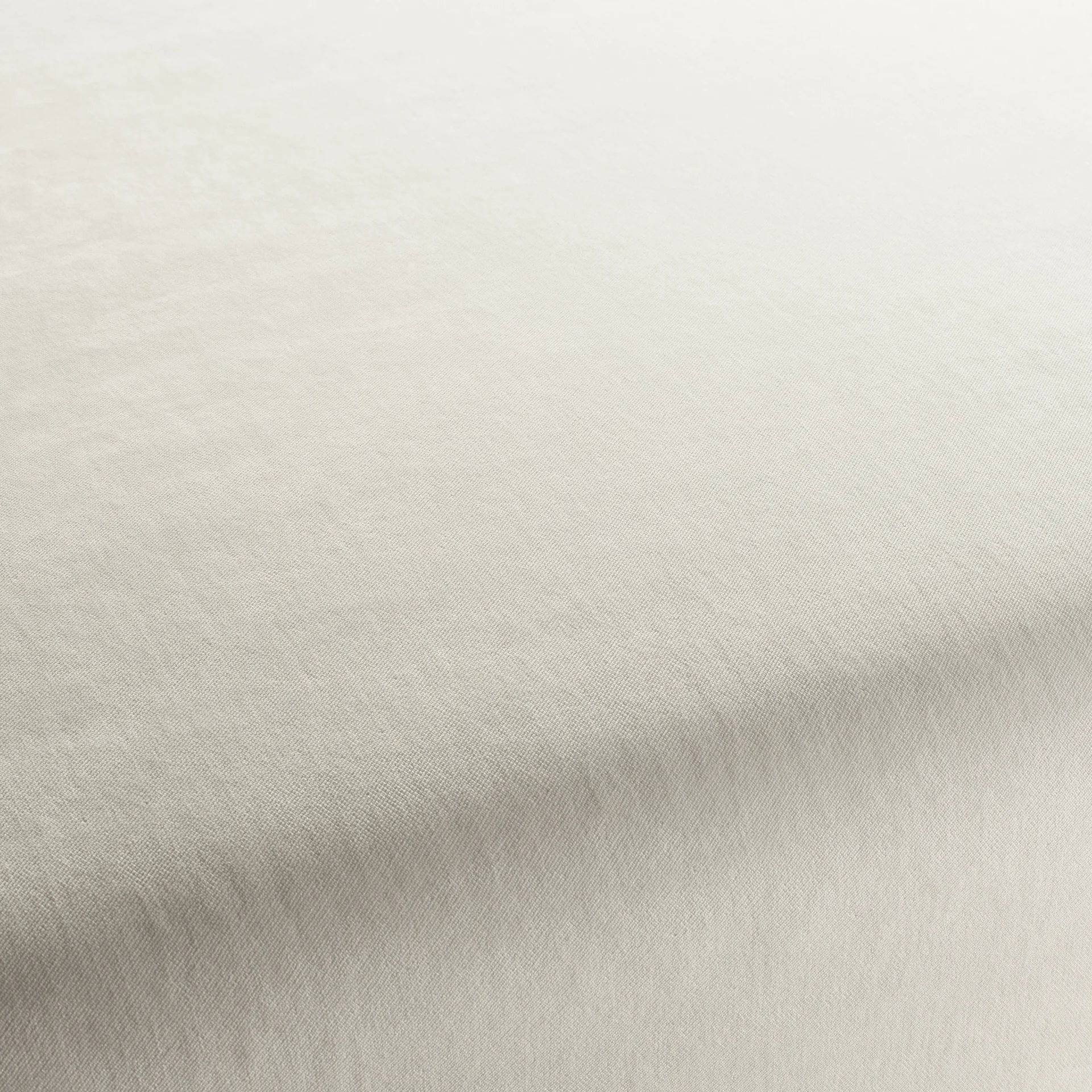 Close-up of soft off-white woven fabric with subtle texture and gentle folds.