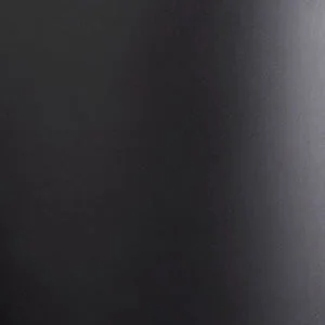 A close-up of a matte black material, showing its smooth texture and surface with a slight sheen from a light source.