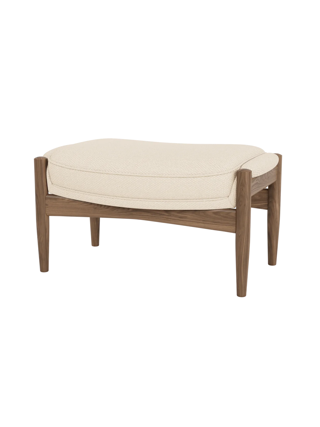 The Seal Ottoman featuring textured Logan Jasmine upholstery and a solid walnut frame with tapered, organic legs.