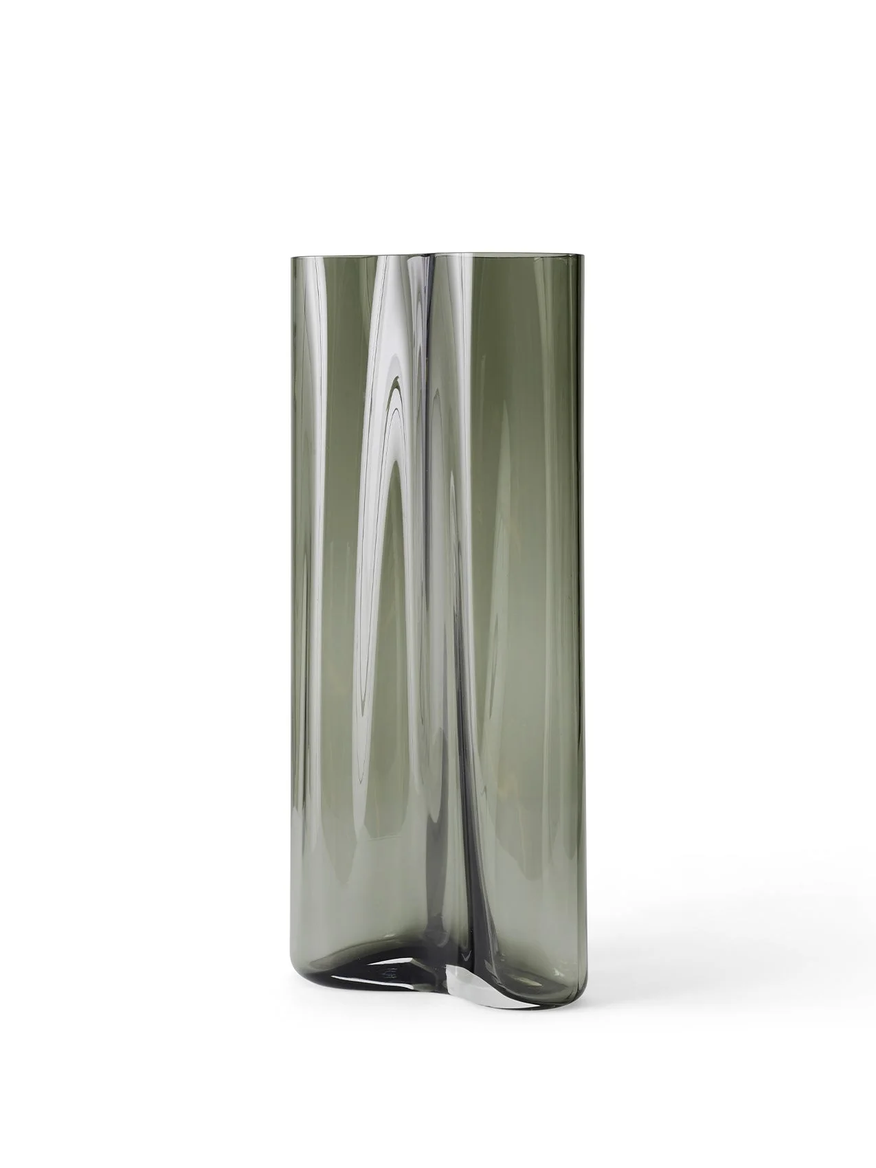 An angled view of the large Aer Vase. The tall, sculptural form is crafted from smoky grey glass with a rippling effect.