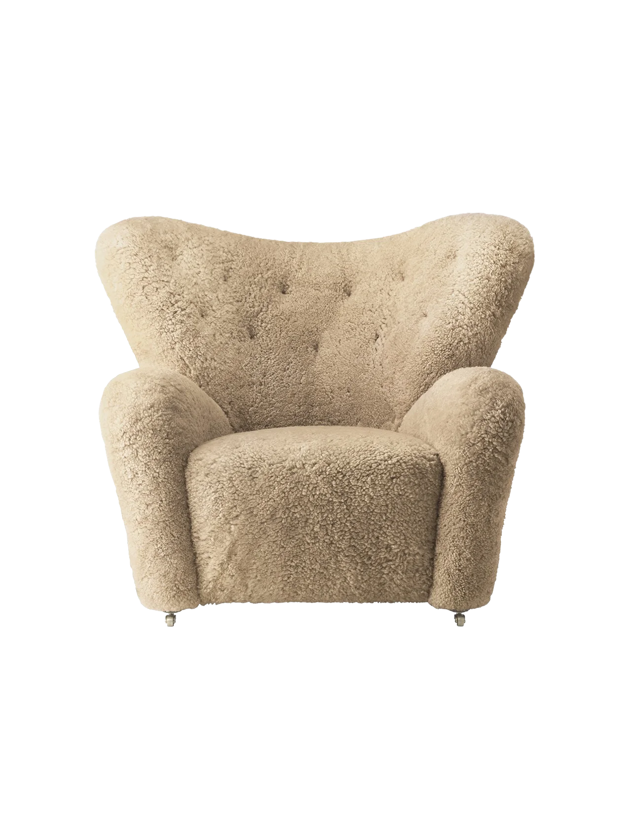 Front view of The Tired Man Lounge Chair in plush honey sheepskin, with a wide winged back and thick rounded arms.
