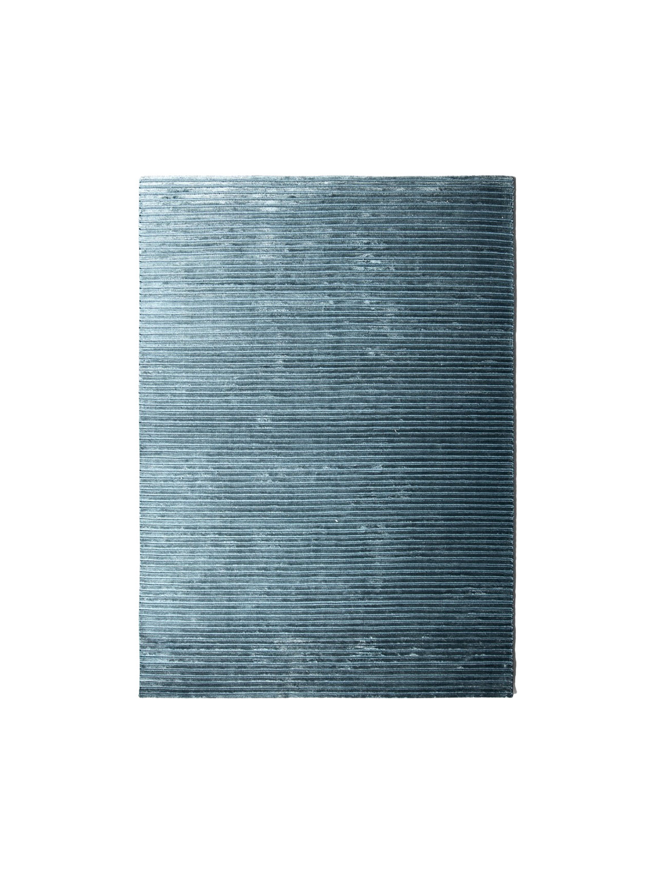 A rectangular swatch of the Houkime Rug in Midnight Blue, with finely ribbed, horizontal texture against a black background.