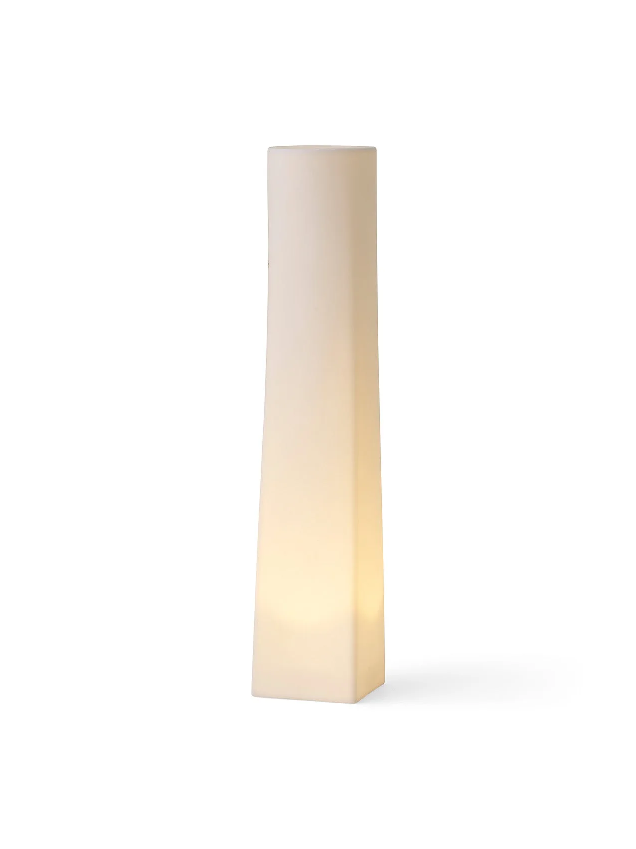 The tall, square-based Ignus Flameless Candle H35, lit from within, casting a soft, warm glow against a white background.