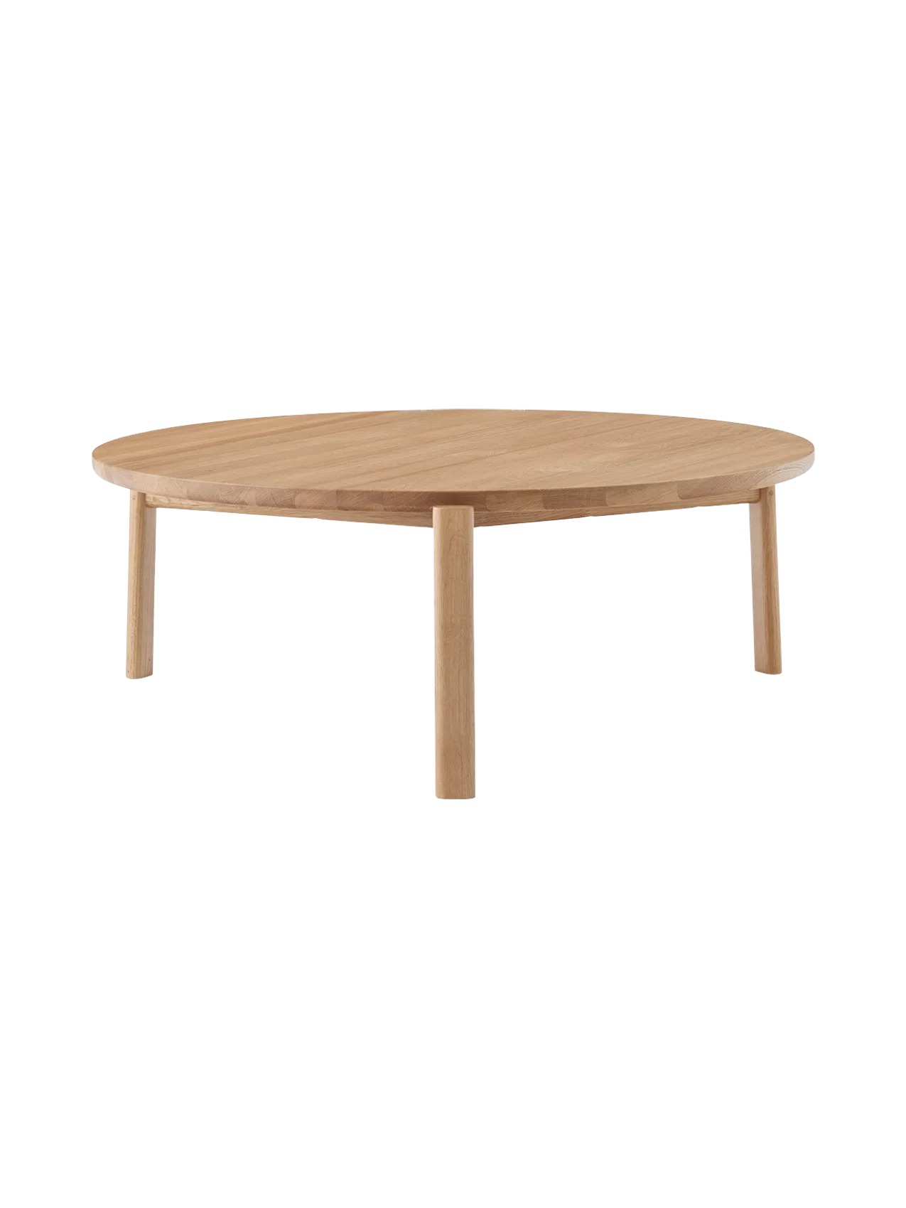 Front view of the Passage Lounge Table in natural oak. The low, round table has a solid wood top and three sturdy legs.