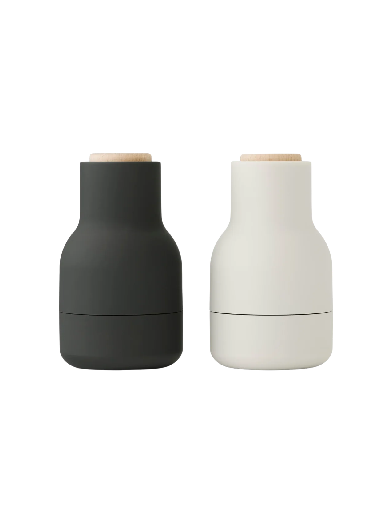 A pair of Audo CPH Bottle Grinders. One is matte carbon, the other matte ash, with beech lids.