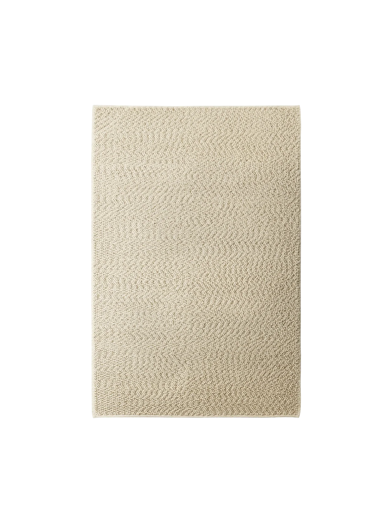 Overhead shot of the Audo CPH Gravel Rug in ivory, showing a close-up of the tactile, herringbone-patterned wool texture.
