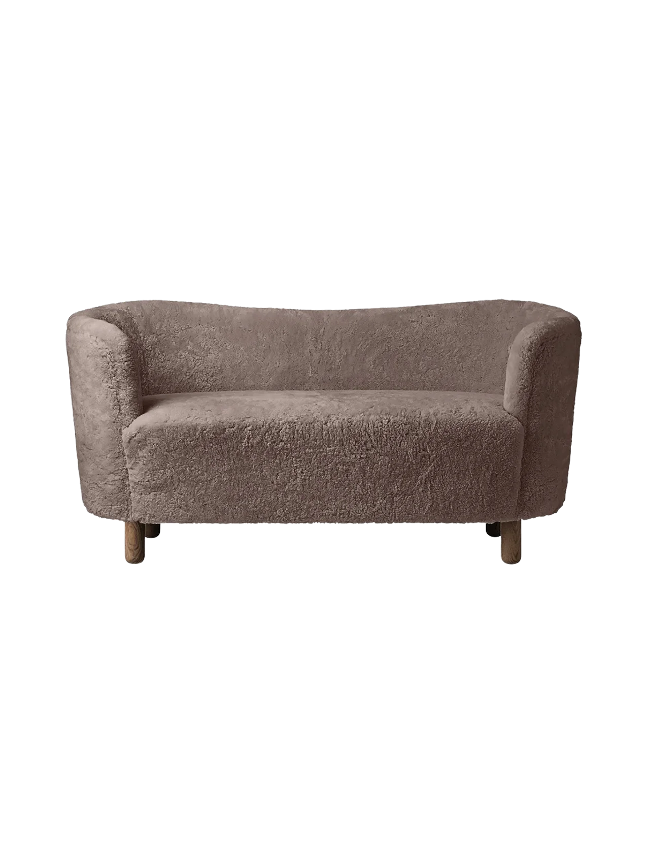 A front view of the Mingle Sofa, upholstered in Sahara-coloured sheepskin, with a curved back and dark-stained oak legs.