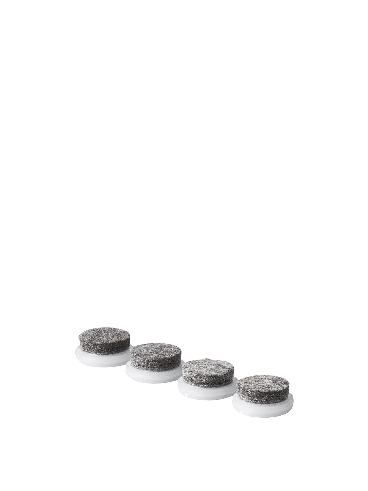 Four round grey felt furniture pads with white plastic bases arranged diagonally on white background