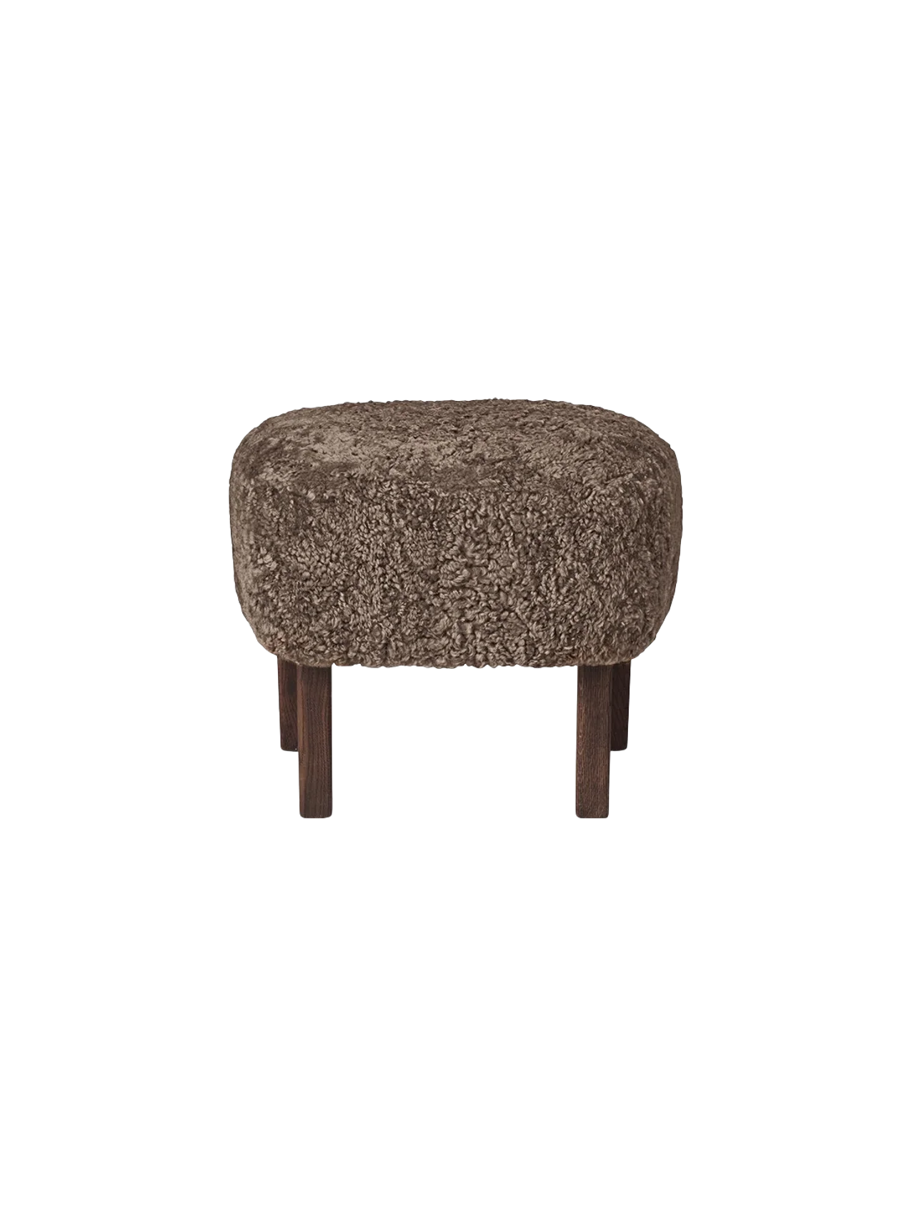 A studio shot of the Ingeborg Ottoman in Sahara sheepskin. The footstool has a textured, brownish top and four dark oak legs.