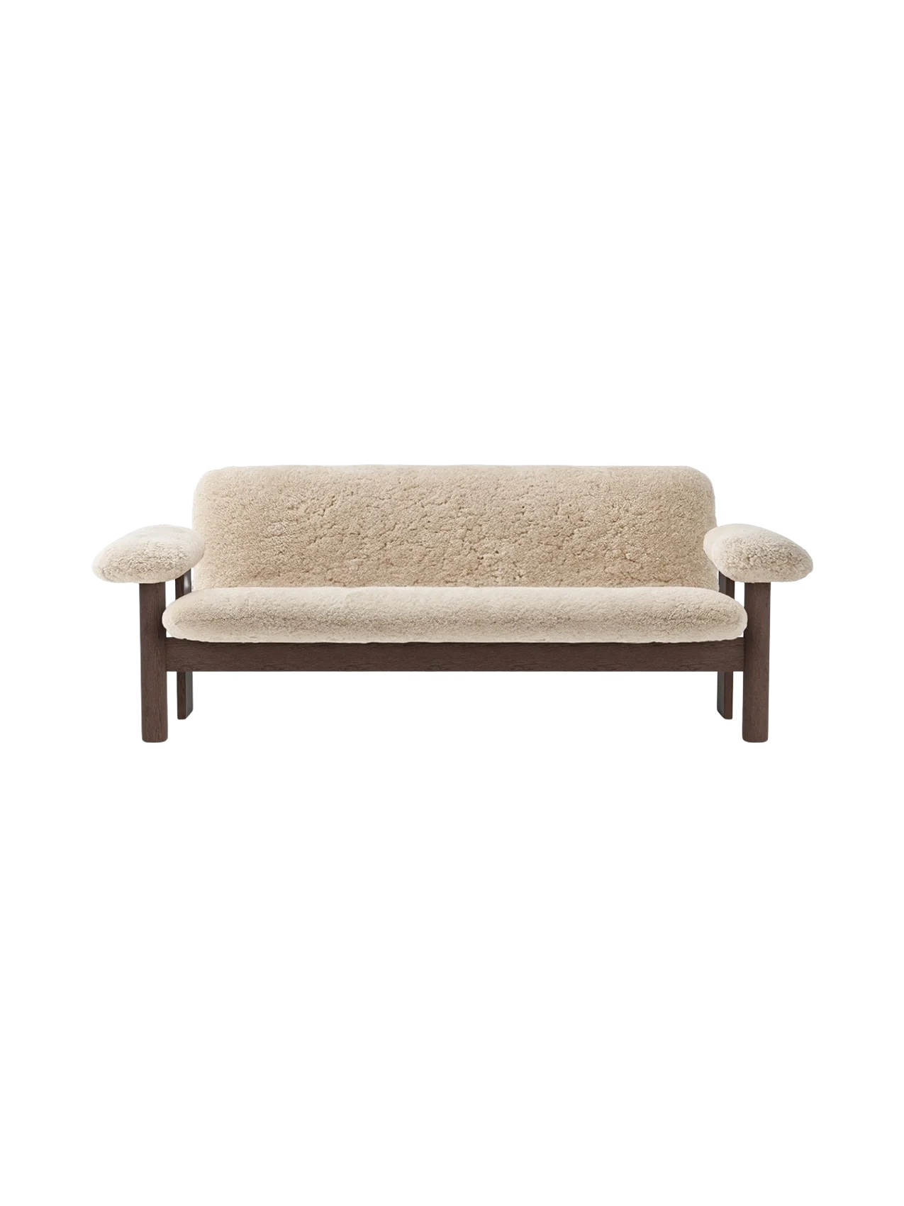 Front view of the Brasilia Sofa, Sheepskin. Features a dark wood frame and plush, off-white sheepskin upholstery.