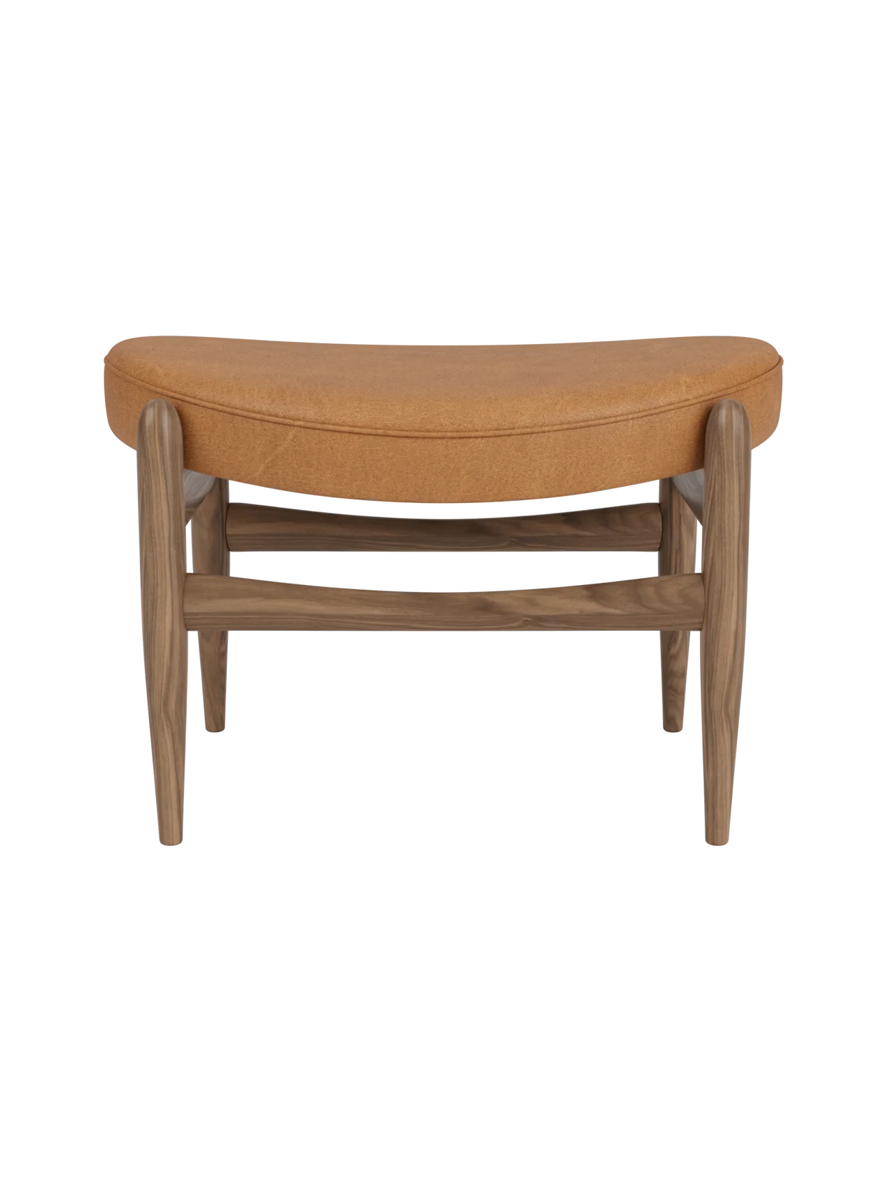 Front view of the Elizabeth Ottoman. The piece has a walnut frame and a curved top cushion upholstered in cognac leather.