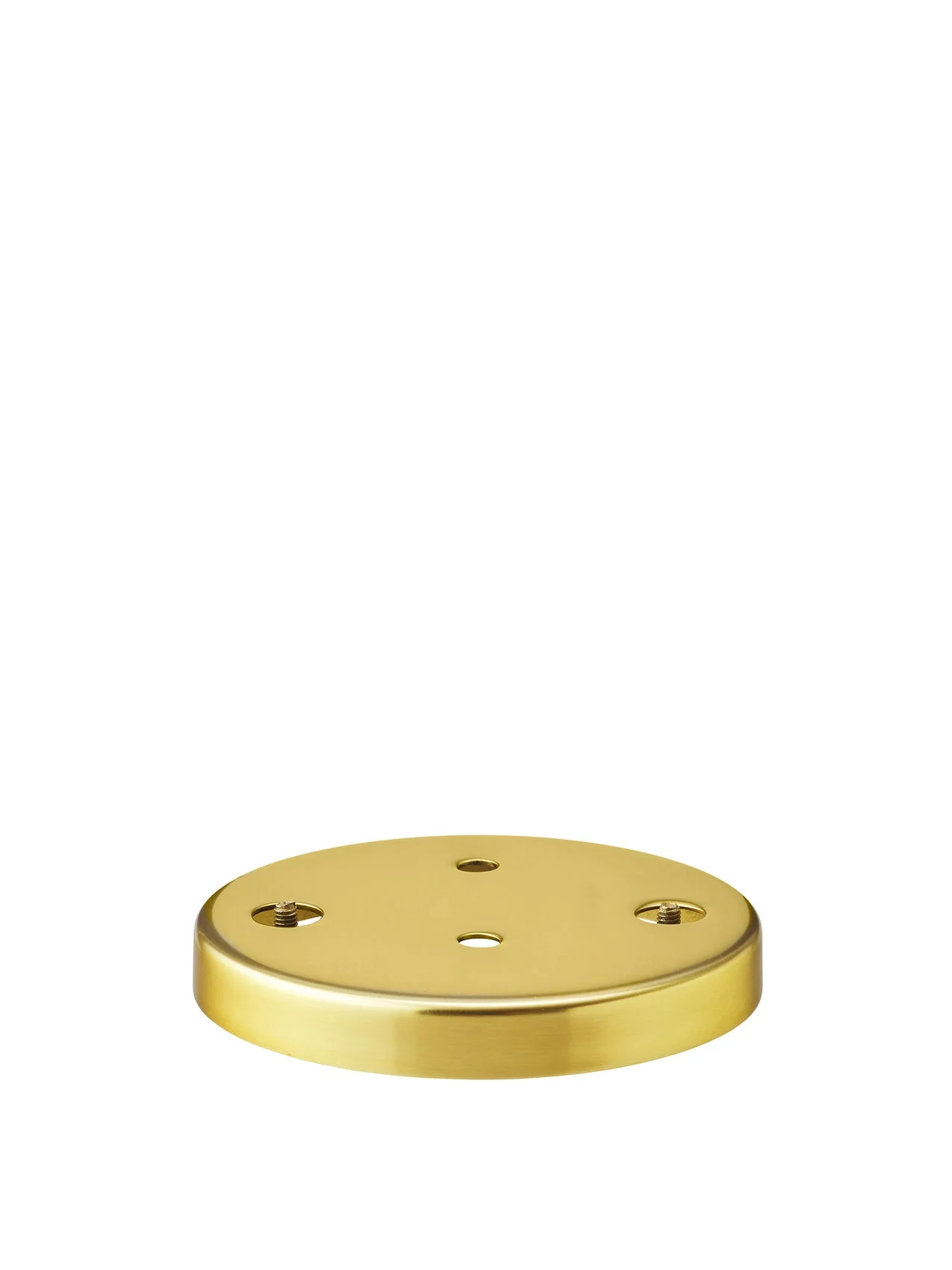 Low-angle shot of the circular brass plate for the Warren Wall Lamp, featuring a brushed finish and screw holes.