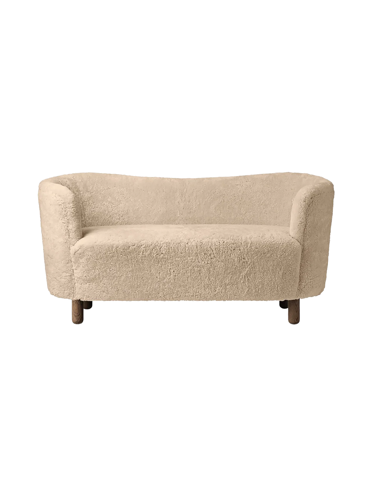 A front view of the Mingle Sofa, upholstered in Honey-coloured sheepskin, with dark stained oak legs, on a black background.