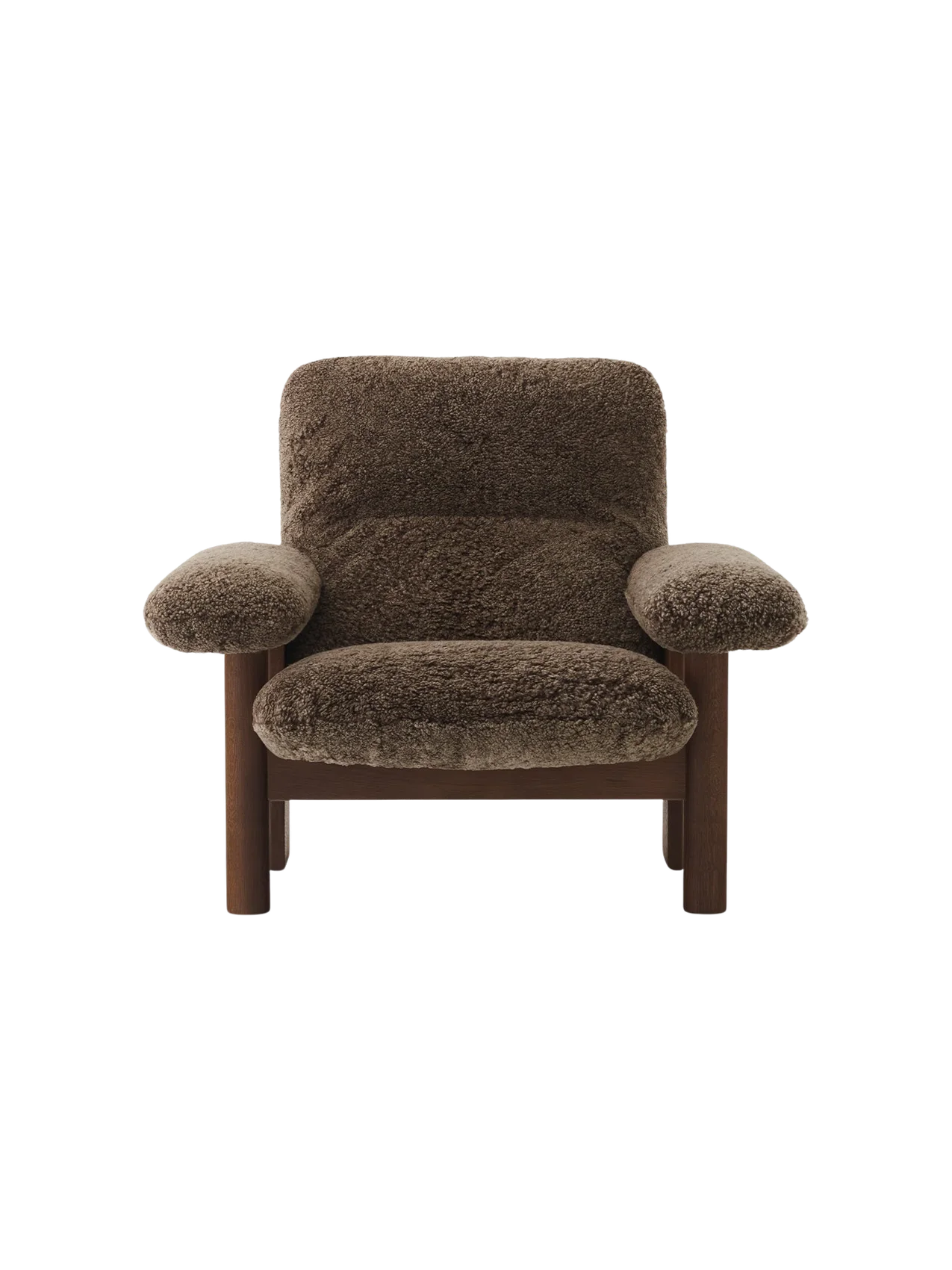 The low-slung Brasilia Lounge Chair seen from the front, with a dark walnut frame and plush, dark brown sheepskin upholstery.