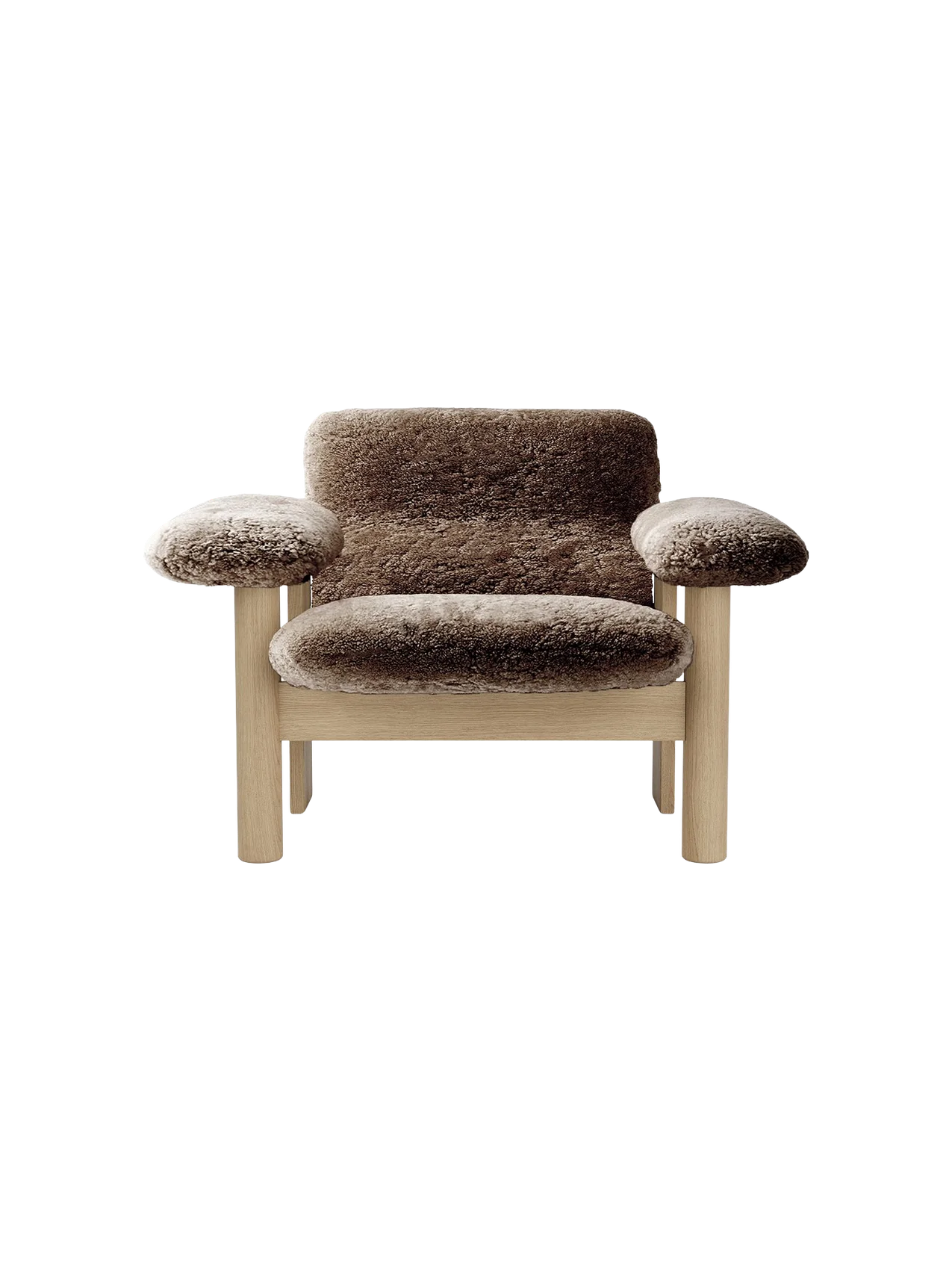 Front view of the Brasilia Lounge Chair, Low Back, with brown sheepskin and a light oak frame on a black background.