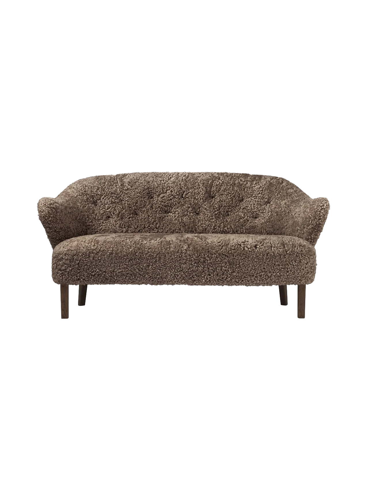 A front view of the Ingeborg Sofa in dark brown Sahara sheepskin, featuring a button-tufted back and dark stained oak legs.