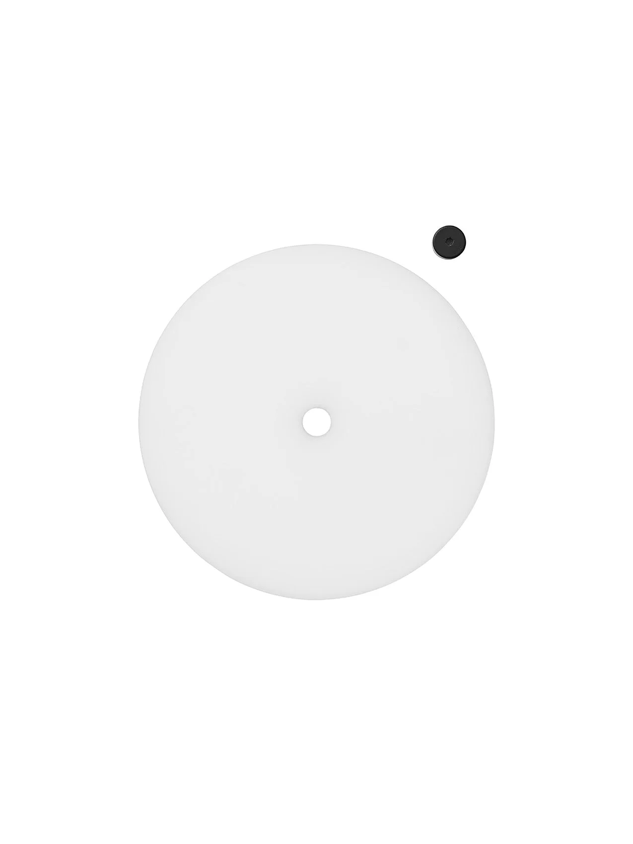 A flat lay image of the Cast Sconce spare parts, a circular white plastic diffuser and a black nut on a white background.