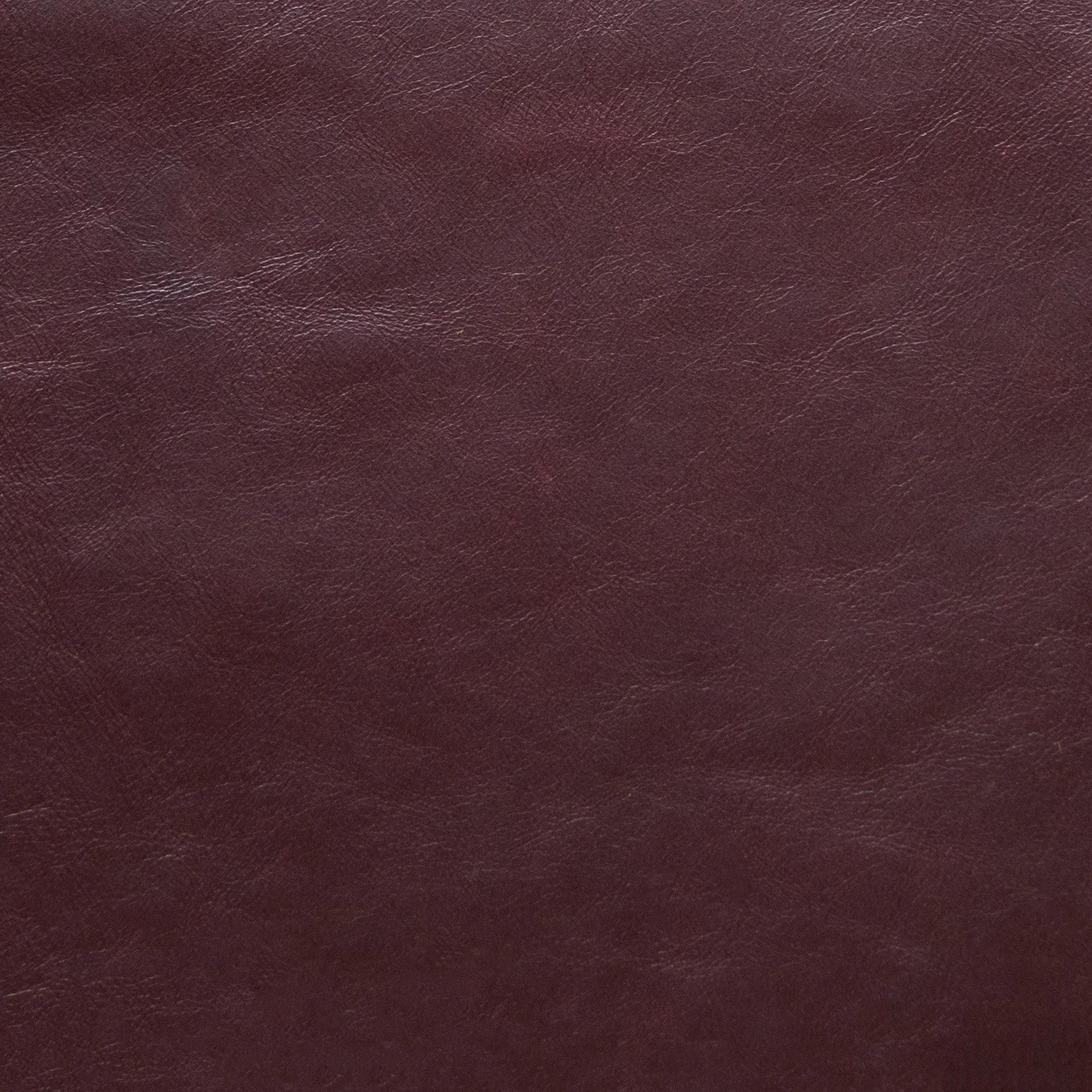 Aida Oeko-Tex upholstery leather in shade 4060, showcasing a smooth brown full-grain aniline surface texture.