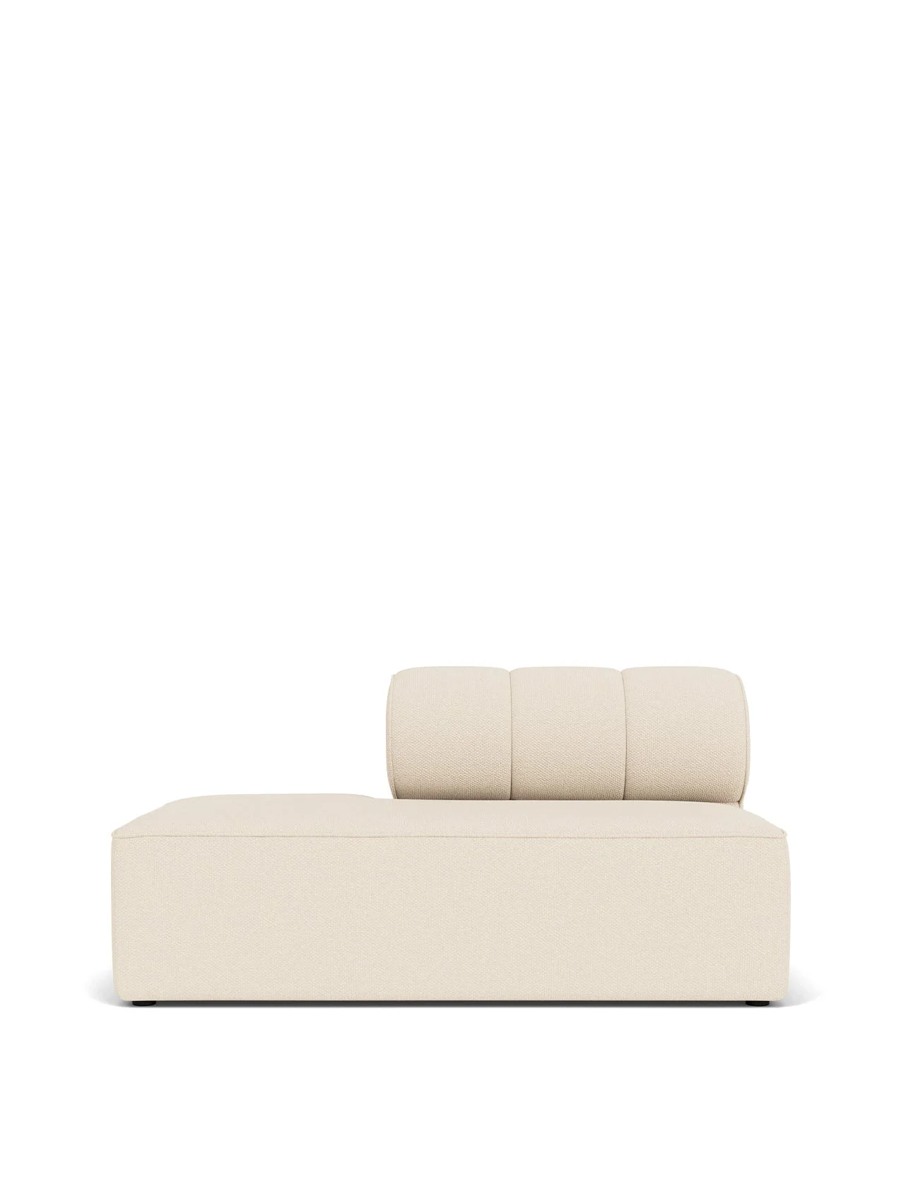 A front-on view of the Eave Seamline Modular Sofa's open-end module, upholstered in a light-coloured textured fabric.