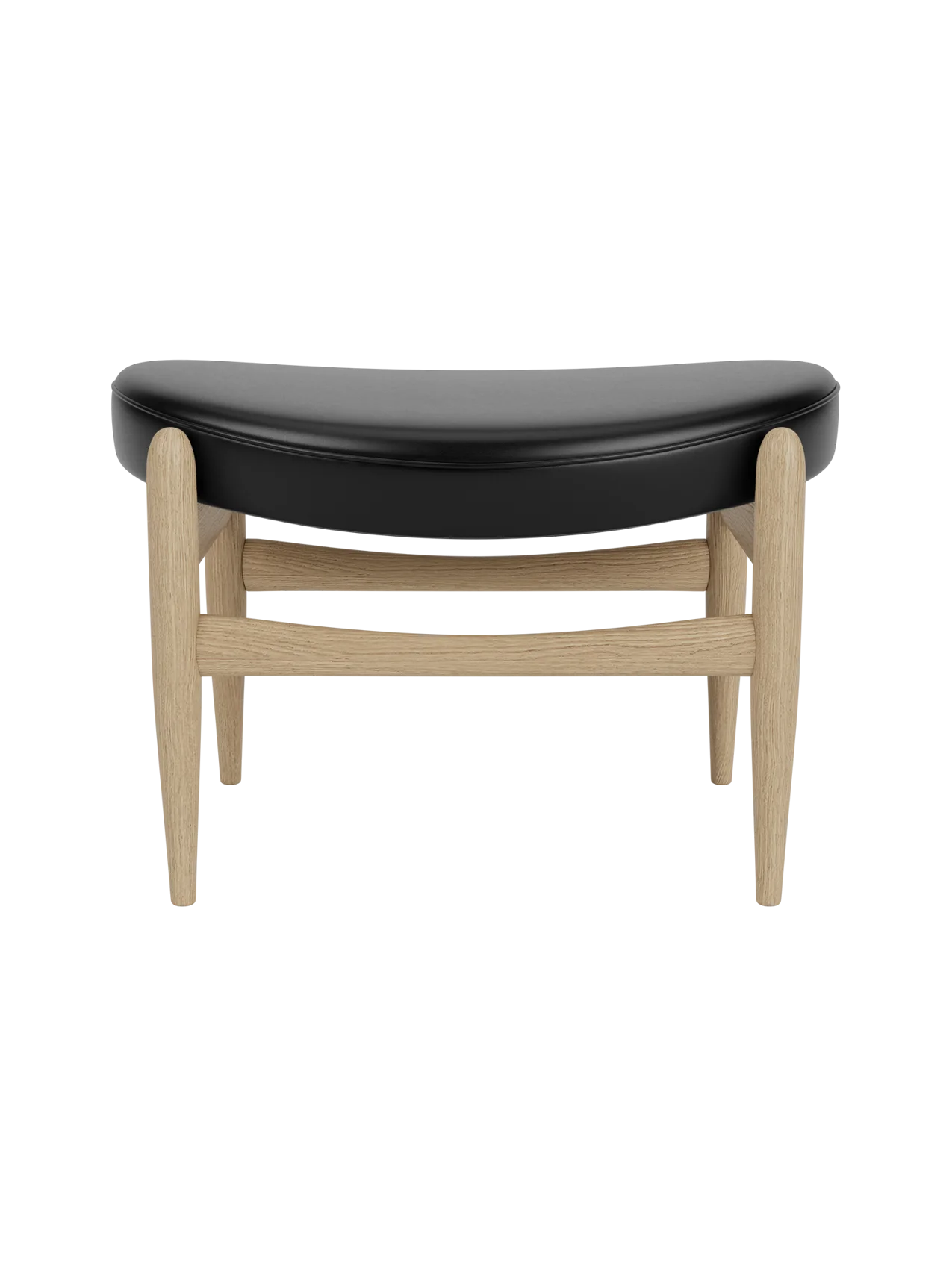 Elizabeth Ottoman featuring a curved black leather seat and a light natural oak frame with tapered legs.