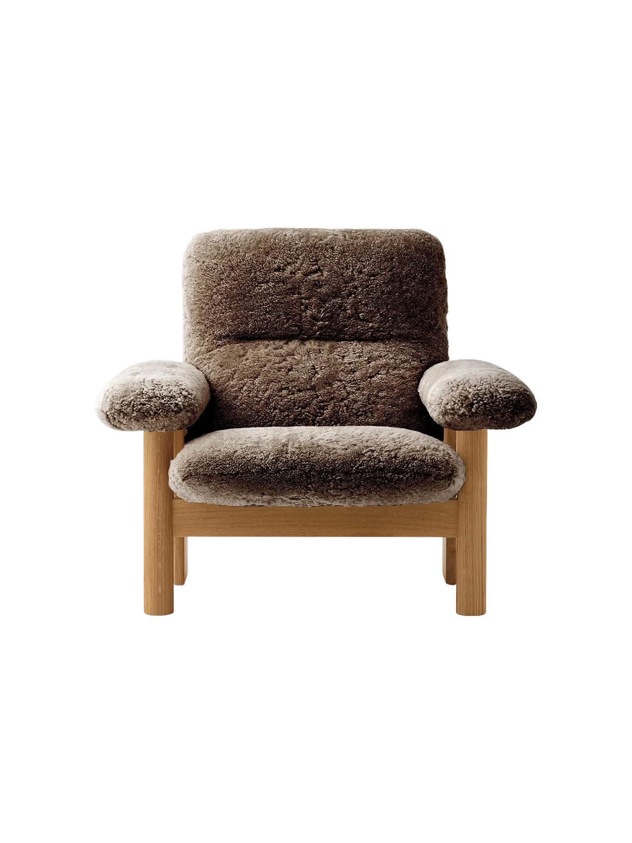 Front view of the Brasilia Lounge Chair with a natural oak frame and thick brown sheepskin upholstery on a black background.