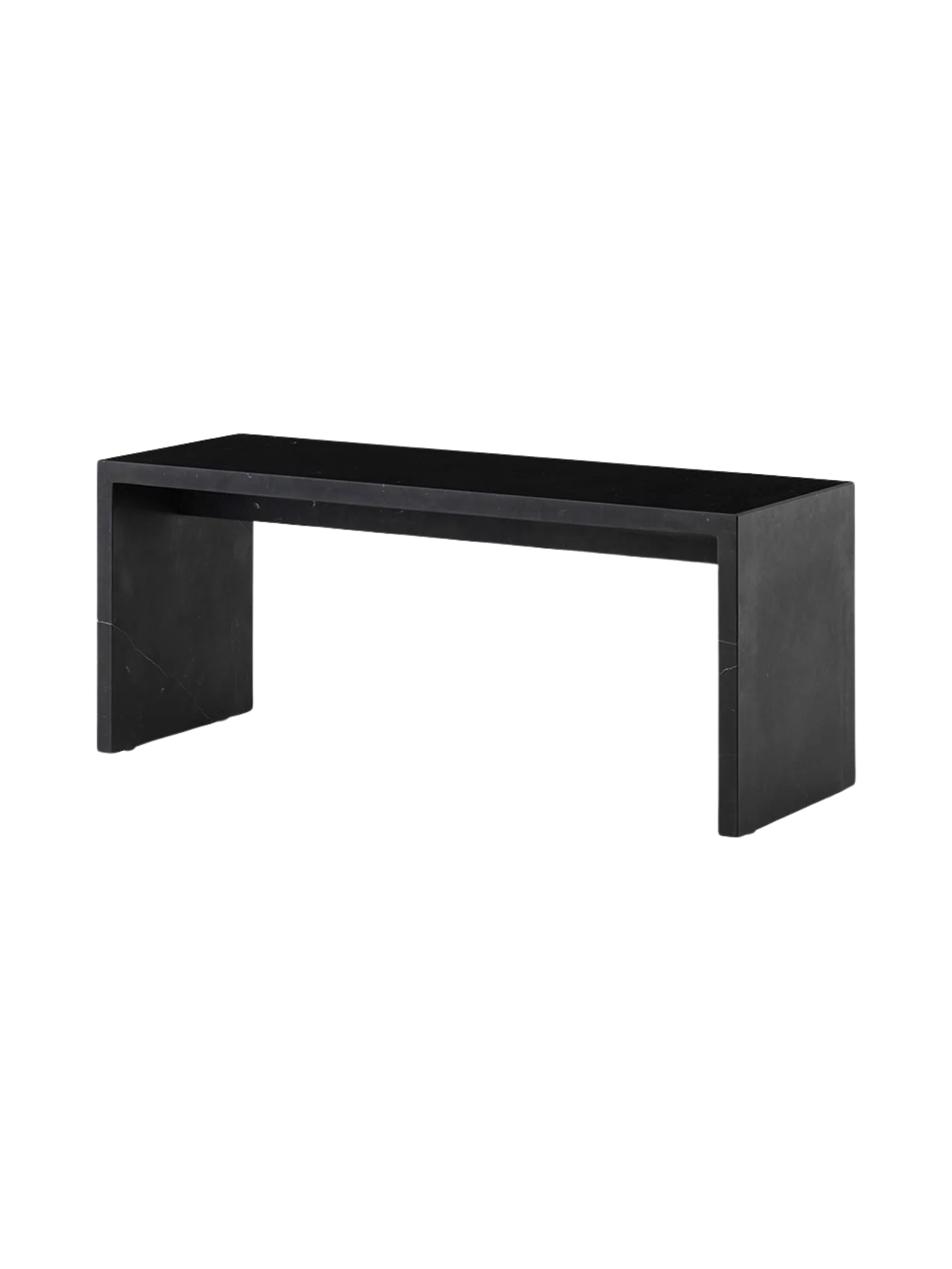 The Plinth Bridge in Nero Marquina, a long and low rectangular bench of black marble with white veins, viewed at an angle.