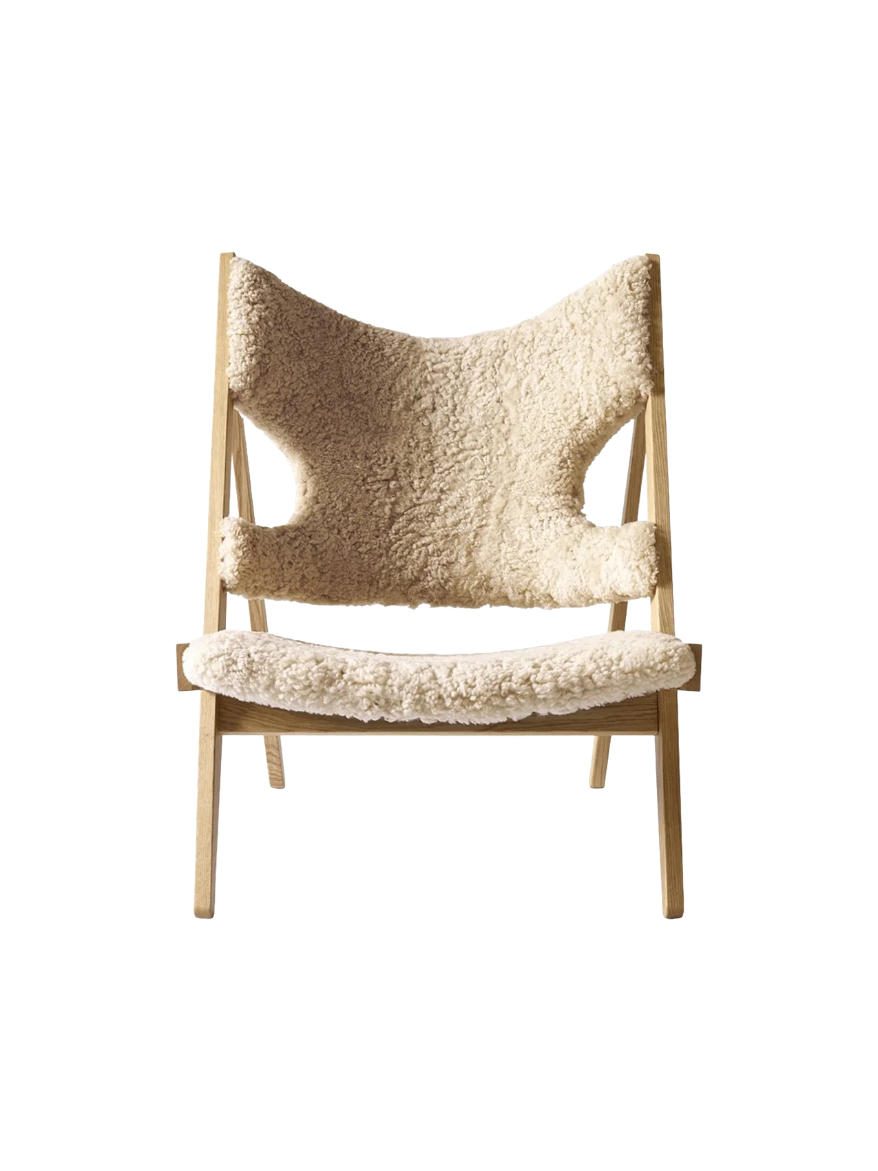 Front view of the Knitting Lounge Chair. The chair has a natural oak frame and off-white, textured sheepskin upholstery.