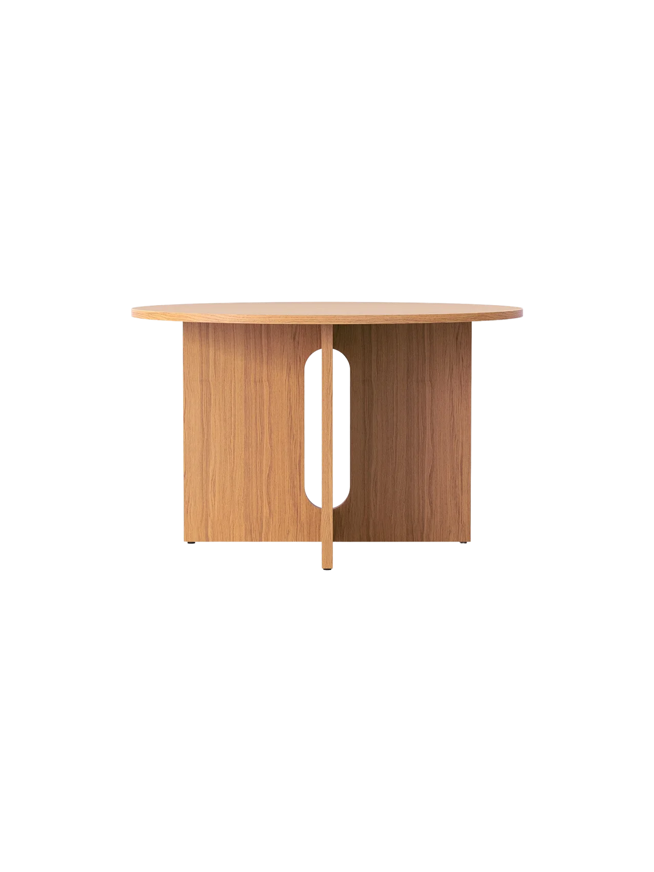 A front view of the round Androgyne Dining Table in natural oak, featuring a wide base with a central, oblong cutout.
